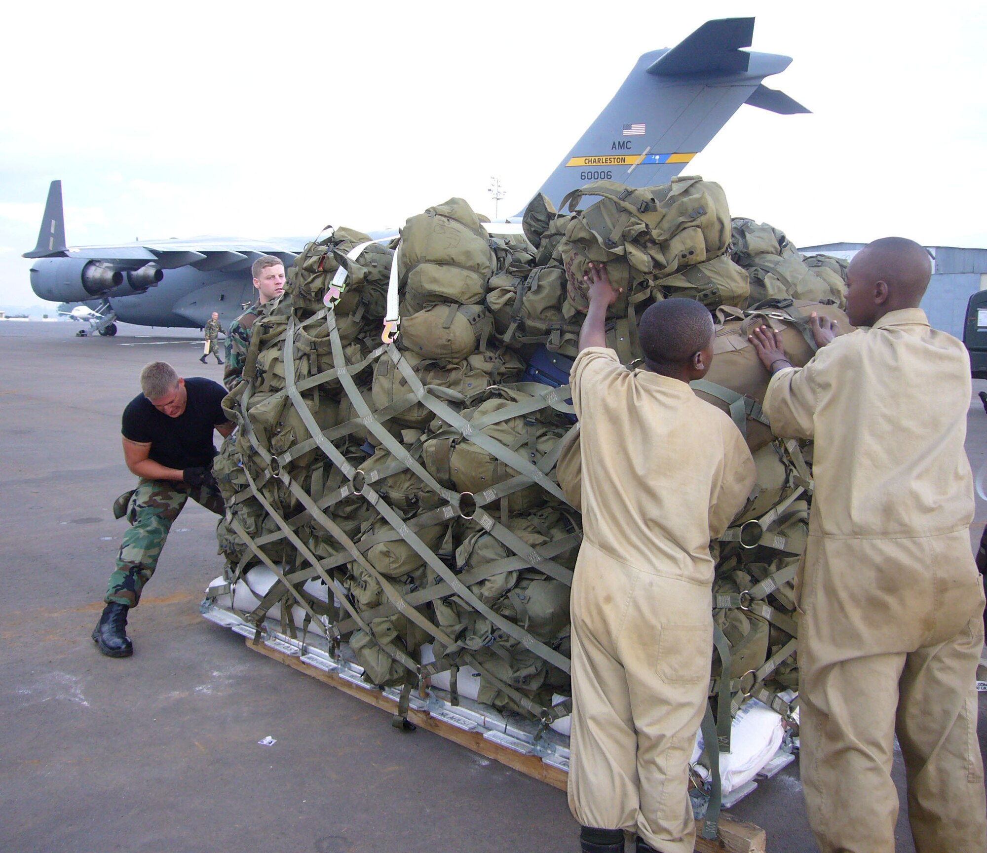 Aerial porters from the 86th Air Mobility Squadron, Ramstein Air Base, Germany, assemble pallets Oct. 20 at the Kigali International Airport, Rwanda, for Rwandan Soldiers deploying to Darfur.  U.S. Air Force Airmen are providing airlift support to the African Union effort in Darfur. 
