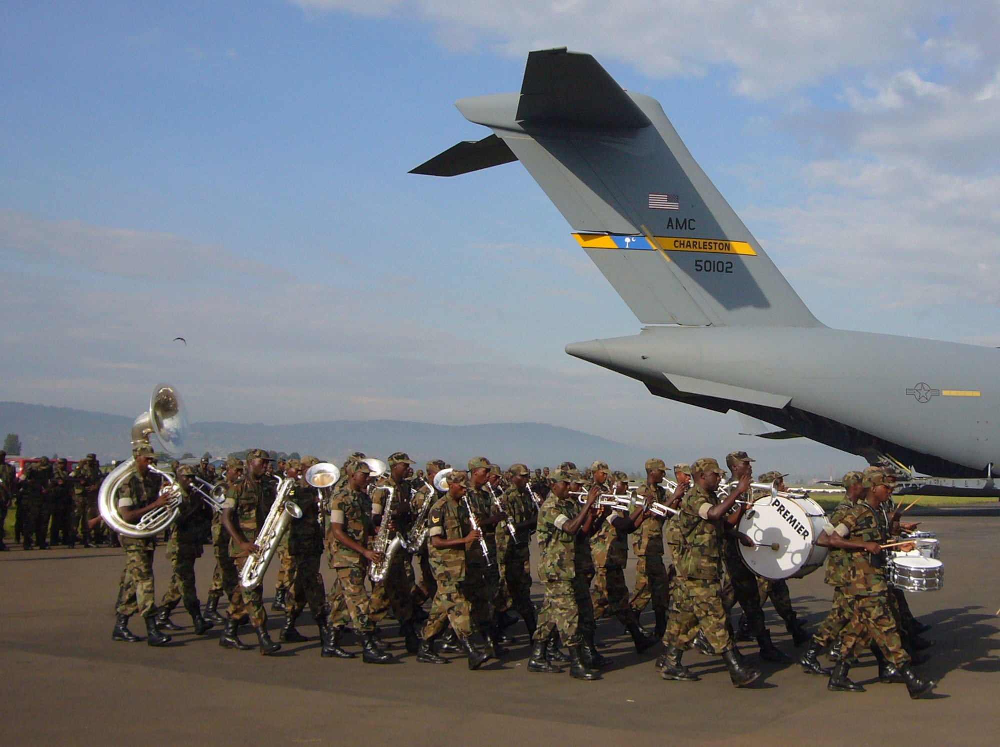 The Rwandan military band performs Oct. 20 at the Kiglai International Airport, Rwanda, for Rwandan Soldiers returning home in a U.S. Air Force C-17 after an 8-month deployment to Darfur.  Airmen from Ramstein Air Base, Germany, and Charleston Air Force Base, S.C., are providing airlift support to the African Union effort in Darfur.  
