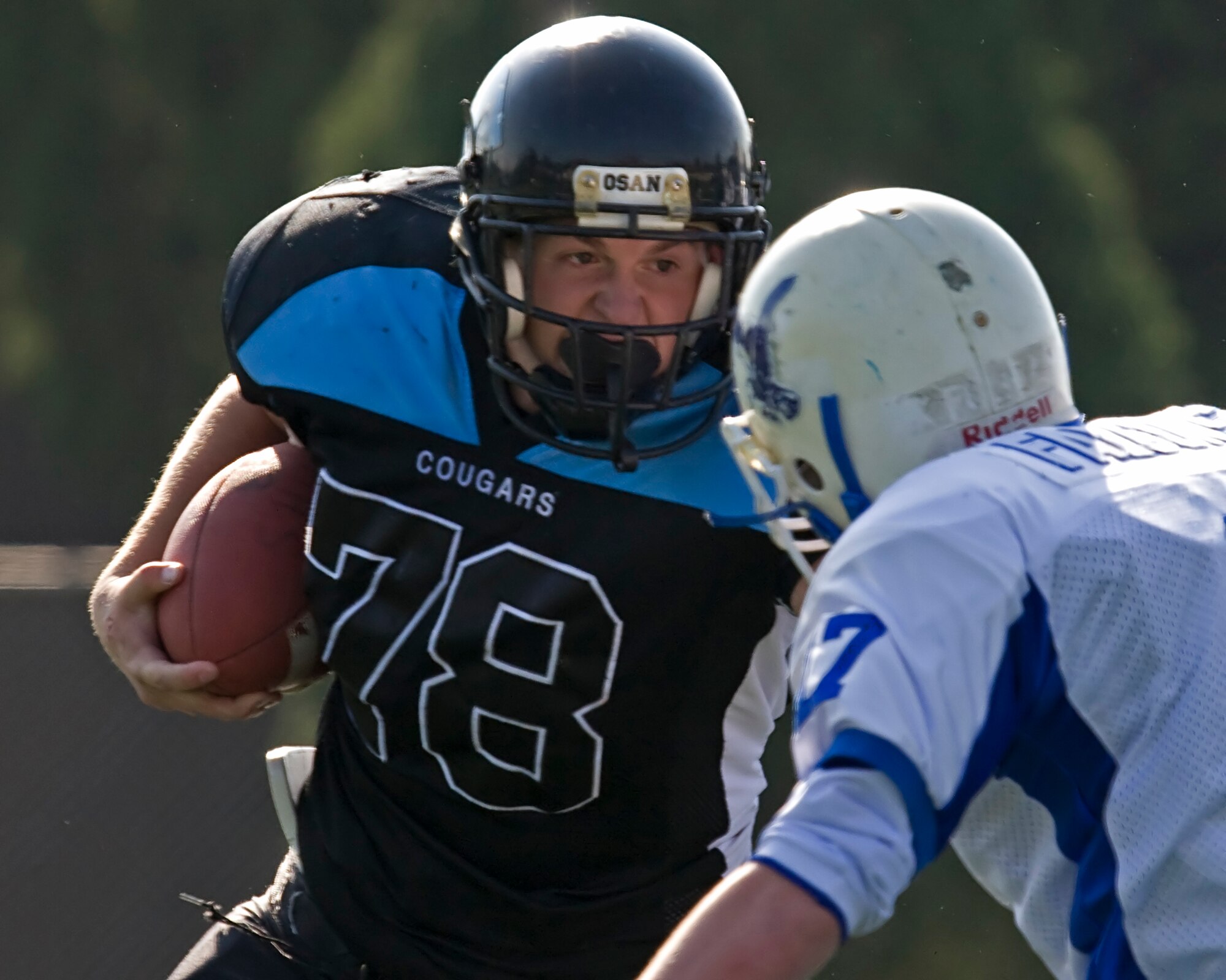 OSAN AIR BASE, Republic of Korea -- Donnie Keshel,  No. 78,  runs fiercely for the Osan American High School Cougars during a game versus Seoul American High School at Yongsan Garrison, Republic of Korea (U.S. Air Force photo by Master Sgt. Benjamin Huseman) (Released)
