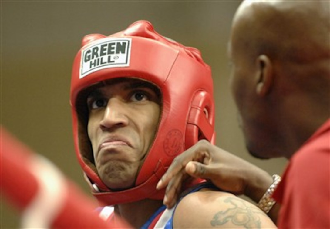 U.S. Army Spc. Alexis Ramos, a 54-kilogram weight class boxer, stands in his corner after a successful round during a bout he won as part of the Conseil International du Sport Militaire's Military World Games in Hyderabad, India, on Oct. 17, 2007.  The games are the largest international, military, Olympic-style event in the world.  