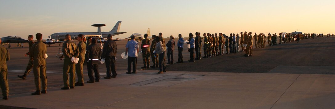 Volunteers prepare for the Foreign Object Damage walk along the 80th Flying Training Wing ramp Oct. 21.  The FOD walk followed the Sheppard Open House and Air Show. (U.S. Air Force photo/Staff Sgt. Tonnette Thompson)