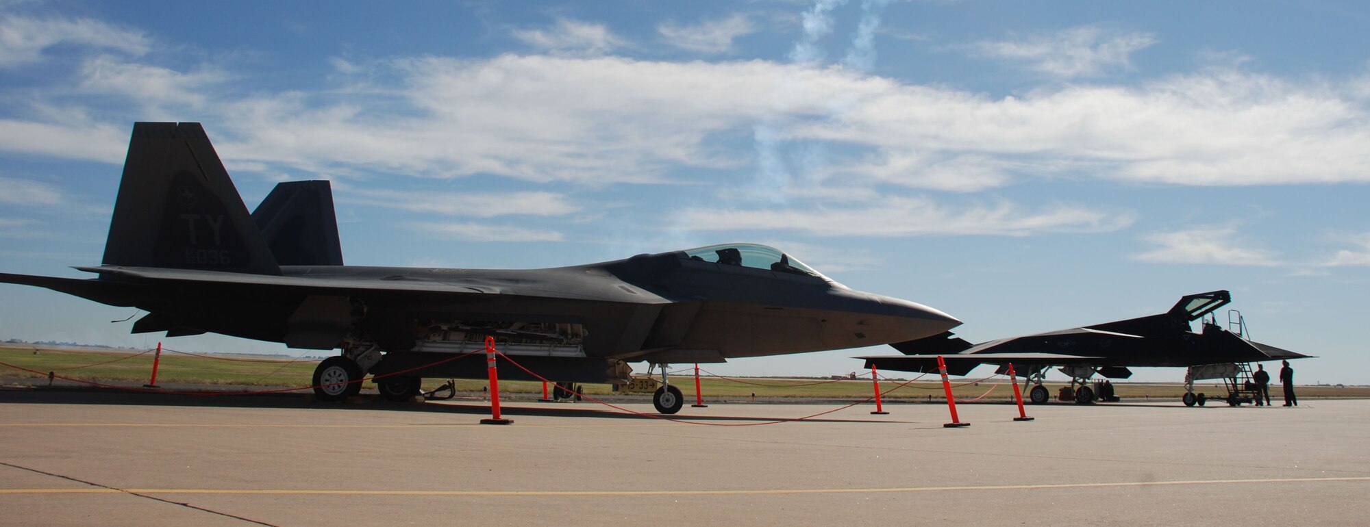Old meets new as the Air Force's first-generation stealth fighter, the F-117A Nighthawk (right), sits next to its next-generation stealth fighter, the F-22A Raptor during Sheppard's 2007 Air Show and Open House Oct. 20. (U.S. Air Force photo/Airman 1st Class Jacob Corbin)