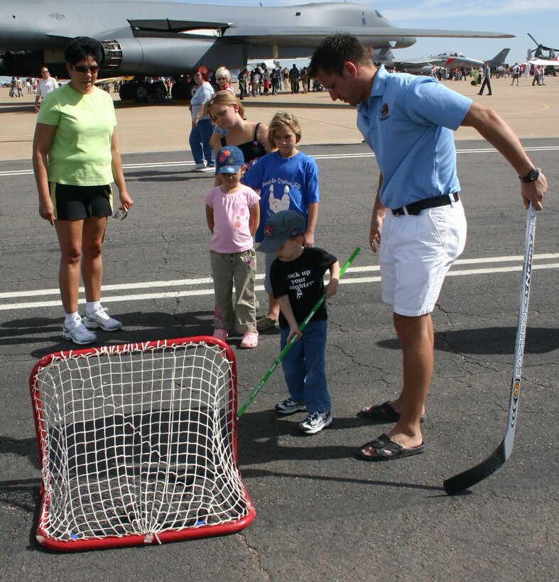 Parents help their children line up along the runway and prepare for takeoff at the Sheppard Open House and Air Show Oct. 20.  The ground attraction was offered by the Stepping Stones to Aviation organization. (U.S. Air Force photo/Staff Sgt. Tonnette Thompson)
