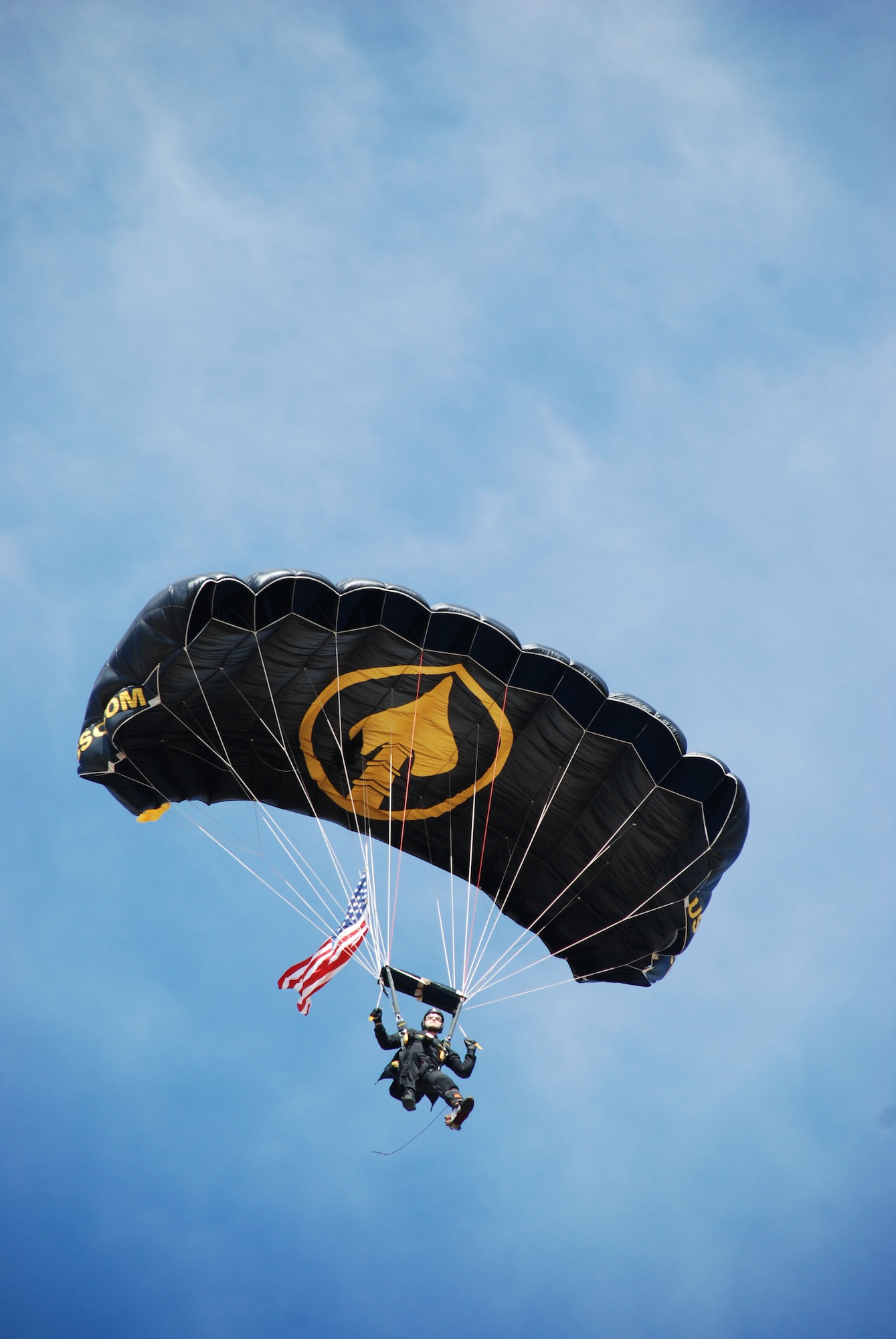 Army Lt. Col. Keith Hanley, a member of the Special Operations Command Parachute team, jumps in to the Sheppard 2007 Open House and Air Show Oct. 20 carrying the American Flag as part of the Sheppard's Open House and Air Show's opening ceremony. (U.S. Air Force photo/Airman 1st Class Jacob Corbin)