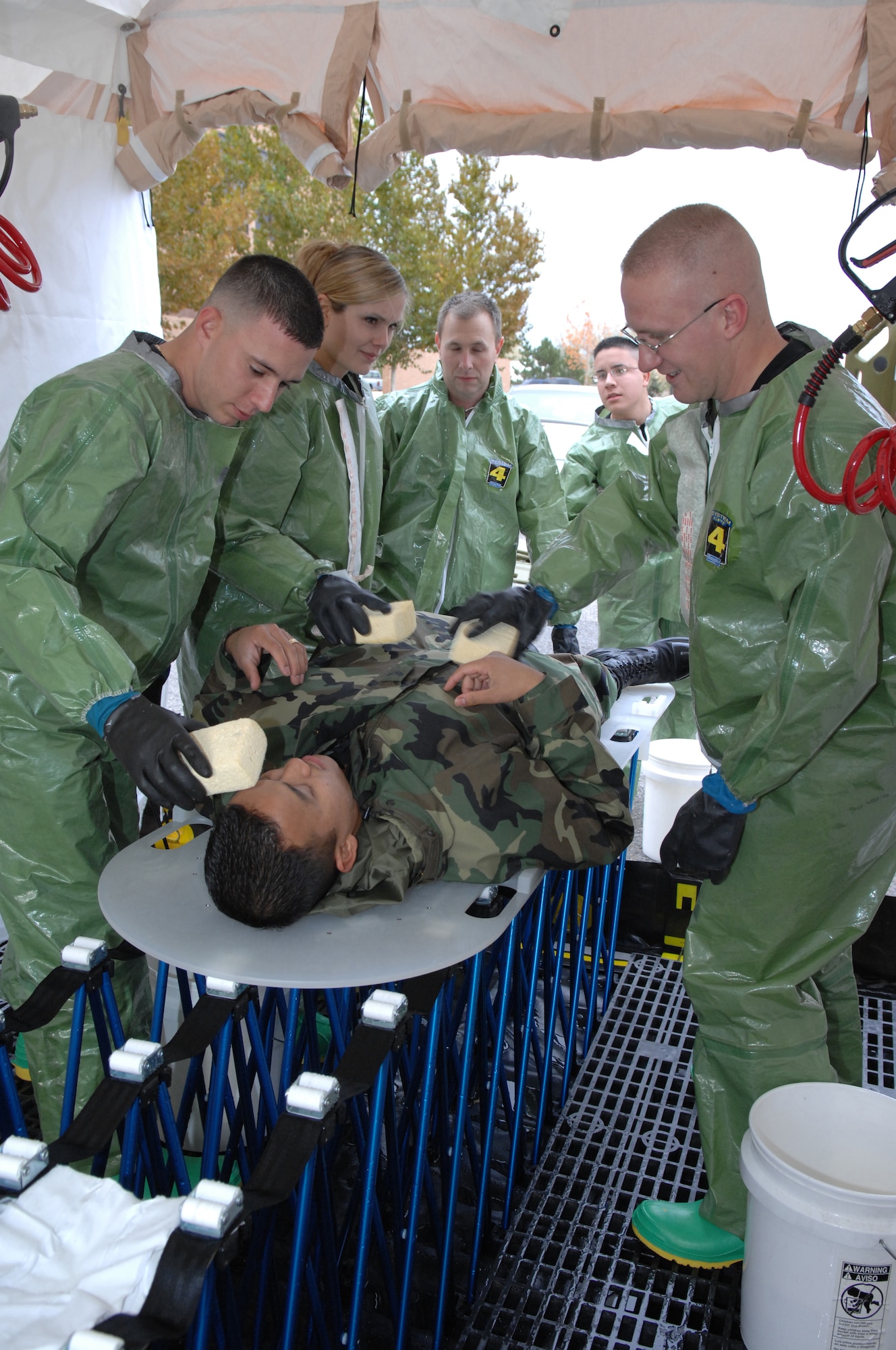MOUNTAIN HOME AIR FORCE BASE, Idaho -- The on-site decontamination team from the 366th Medical Operations Squadron cleans off victims prior to transportation to medical facility here Oct. 18 during an exercise scenario. Gunfighters are participating in Sharpshooter Exercise 08-01 in preparation for the March 2008 operational readiness inspection. (U.S. Air Force photo/ Staff Sgt. Kathy Parker)