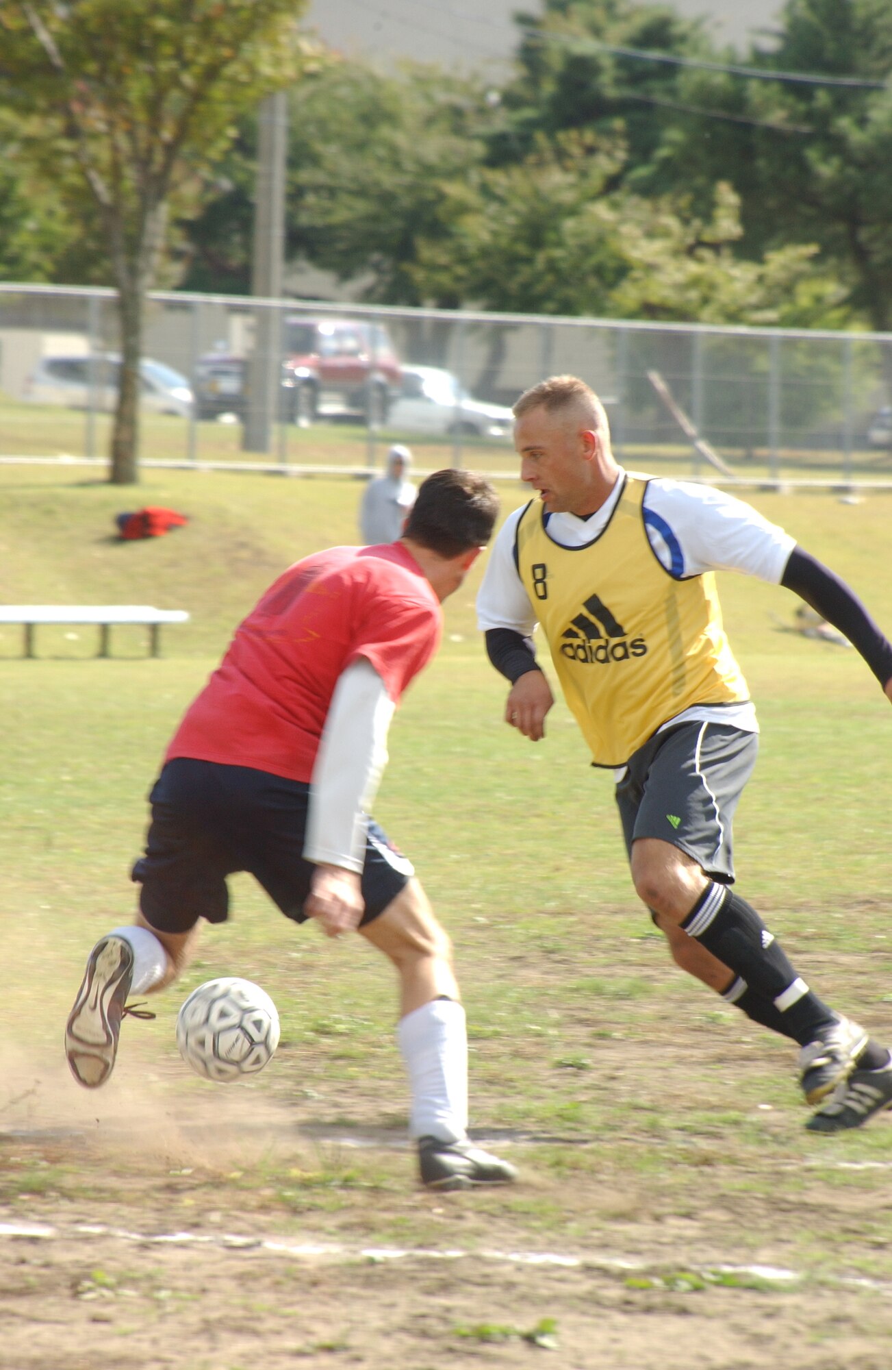 MISAWA AB, Japan -- Staff Sgt. Daniel Friedline, 35th Civil Engineer Squadron (right), competes against Navy Lt. Cmdr. Michael Robles, Combined Task Force 72, during a soccer championship at the base soccer field on Oct. 13, 2007.  The championship marked the end of a year-long season of games, concluding with a 35th CES victory over the Navy's team comprised of CTF-72 and deployed personnel. (U.S. Air Force photo by SrA Robert Barnett)