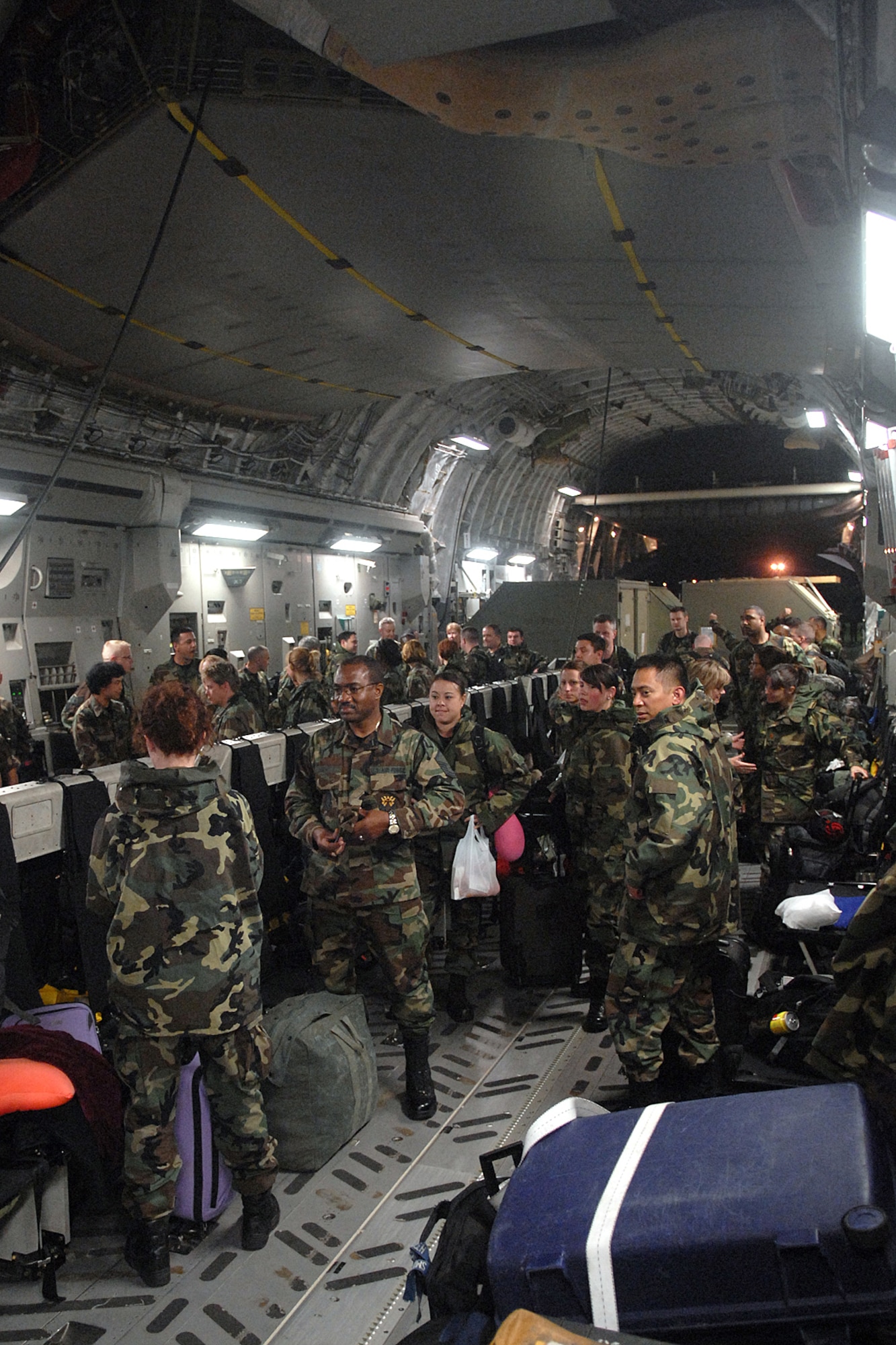 KUNSAN AIR BASE, South Korea -- Airmen from the 944th Medical Squadron, Air Force Reserve, wait to exit the C-17 Globemaster III Oct. 23 here.  The deployment of 944th Medical Squadron, Luke AFB, Ariz., is to build up an Expeditionary Medical System (EMEDS) +25 Theater Hospital. (U.S. Air Force photo/Senior Airman Giang Nguyen)