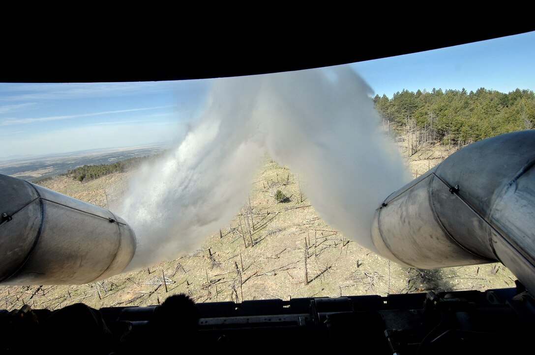 Two Air Force Reserve Command C-130 Hercules aircraft, equipped with Modular Airborne Firefighting Systems like this C-130 dropping water during annual MAFFS training in New Mexico, have been dispatched to help battle wildfires in California.  The aircraft are from the 302nd Airlift Wing at Peterson Air Force Base, Colo.  (U.S Air Force photo/Tech. Sgt. Rick Sforza)