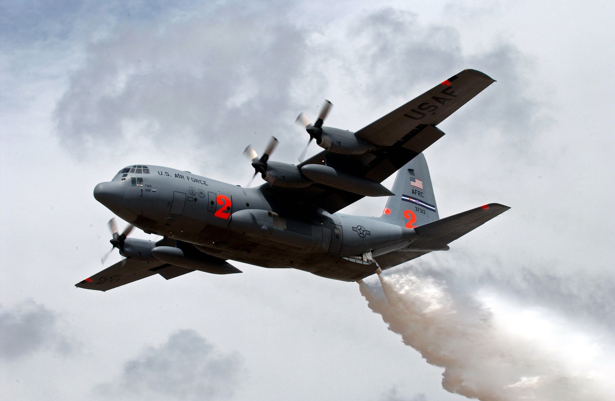 Two Air Force Reserve Command C-130 Hercules aircraft, equipped with Modular Airborne Firefighting Systems like this C-130 dropping water during annual MAFFS training in New Mexico, have been dispatched to help battle wildfires in California.  The aircraft are from the 302nd Airlift Wing at Peterson Air Force Base, Colo.  (U.S Air Force photo/Tech. Sgt. Rick Sforza)