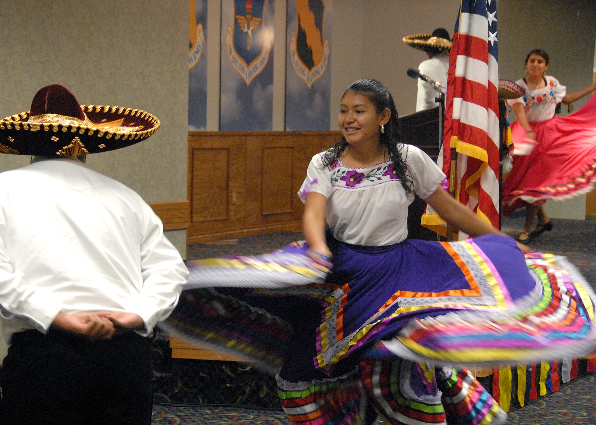 Members of Familia Hernandez and Grupo Mexitzos, a Mexican-Heritage dance group, perform at the Sheppard Hispanic Heritage Month Luncheon at the Sheppard Club Oct. 22. (U.S. Air Force photo/Mike Litteken)
