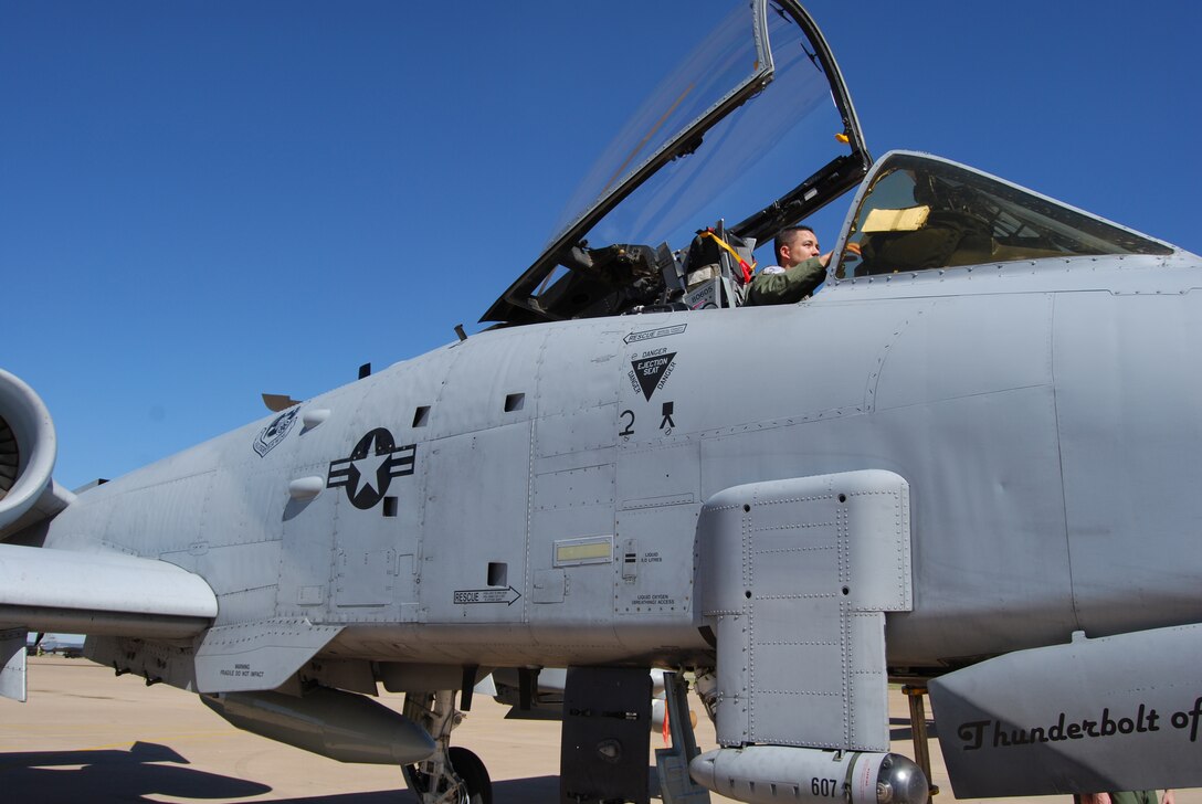 Second Lt. Samuel Stephens, a student pilot in the Euro-NATO Joint Jet Pilot Training Program, gets an inside look at the A-10 Thunderbolt II during Combat Air Force Day Oct. 19. The lieutenant is a member of the Air National Guard and will fly the F-16 upon graduation in April. (U.S. Air Force photo/John Ingle)