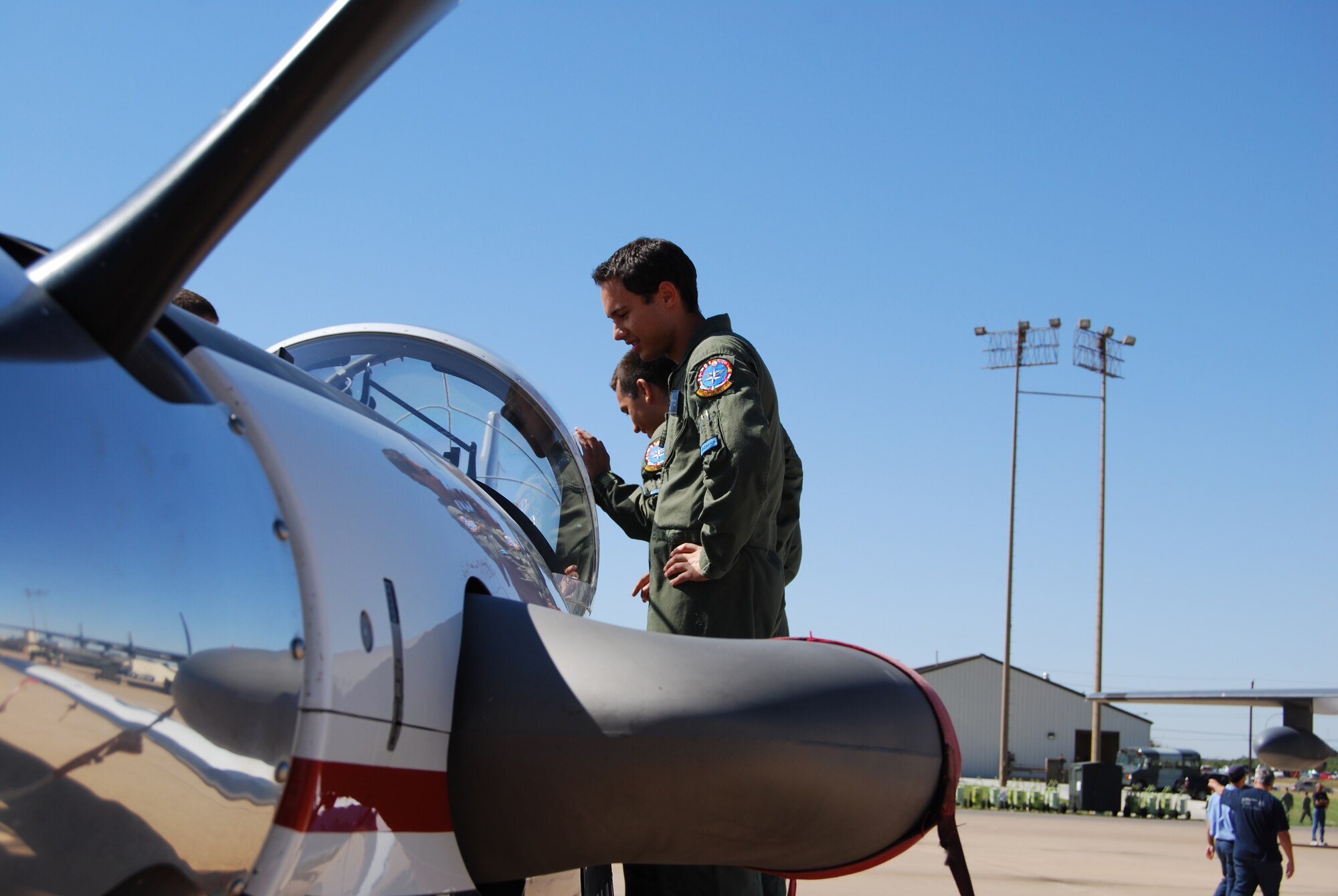 A couple of Euro-NATO Joint Jet Pilot Training student pilots get a closeup of the future of the program, the T-6A Texan II. The introductory trainer was on hand for the annual Combat Air Force Day at the 80th Flying Training Wing. (U.S. Air Force photo/John Ingle)