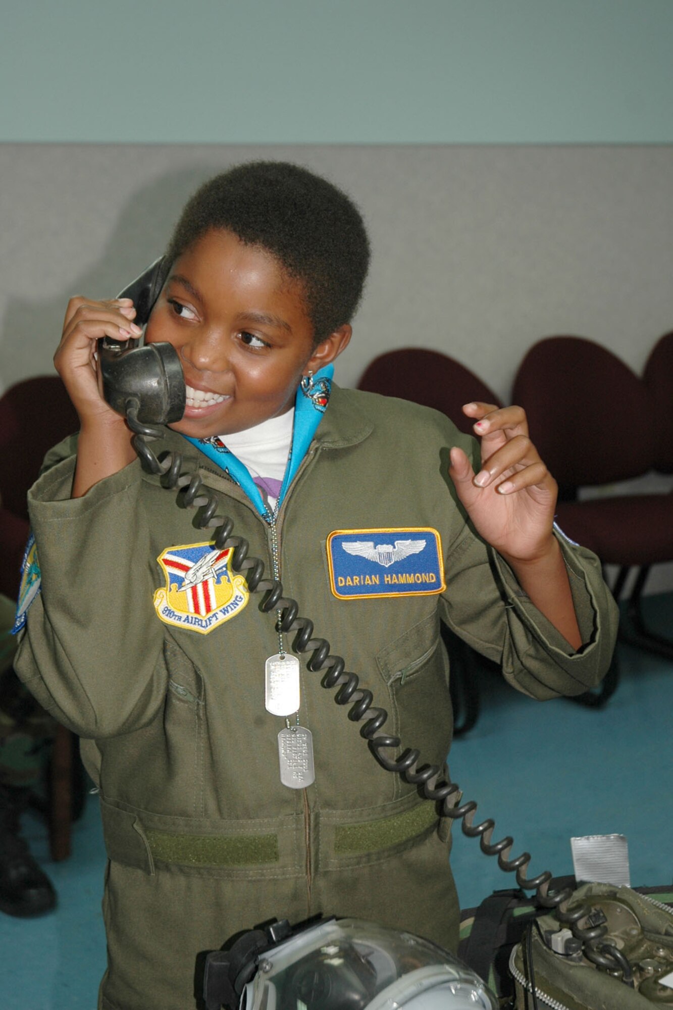 YOUNGSTOWN AIR RESERVE STATION, Ohio — Air Force Reserve Honorary 2nd Lt. Darian Hammond, the 910th Airlift Wing's Pilot for a Day, talks on a field phone to a member of the 910th Security Forces Squadron in the SFS building during her base visit here. She is the 30th child to particpate in the outreach program that provides a tour and orientation for children who have life-threatening or chronic illnesses. U.S. Air Force photo/Tech. Sgt. Bob Barko Jr.
