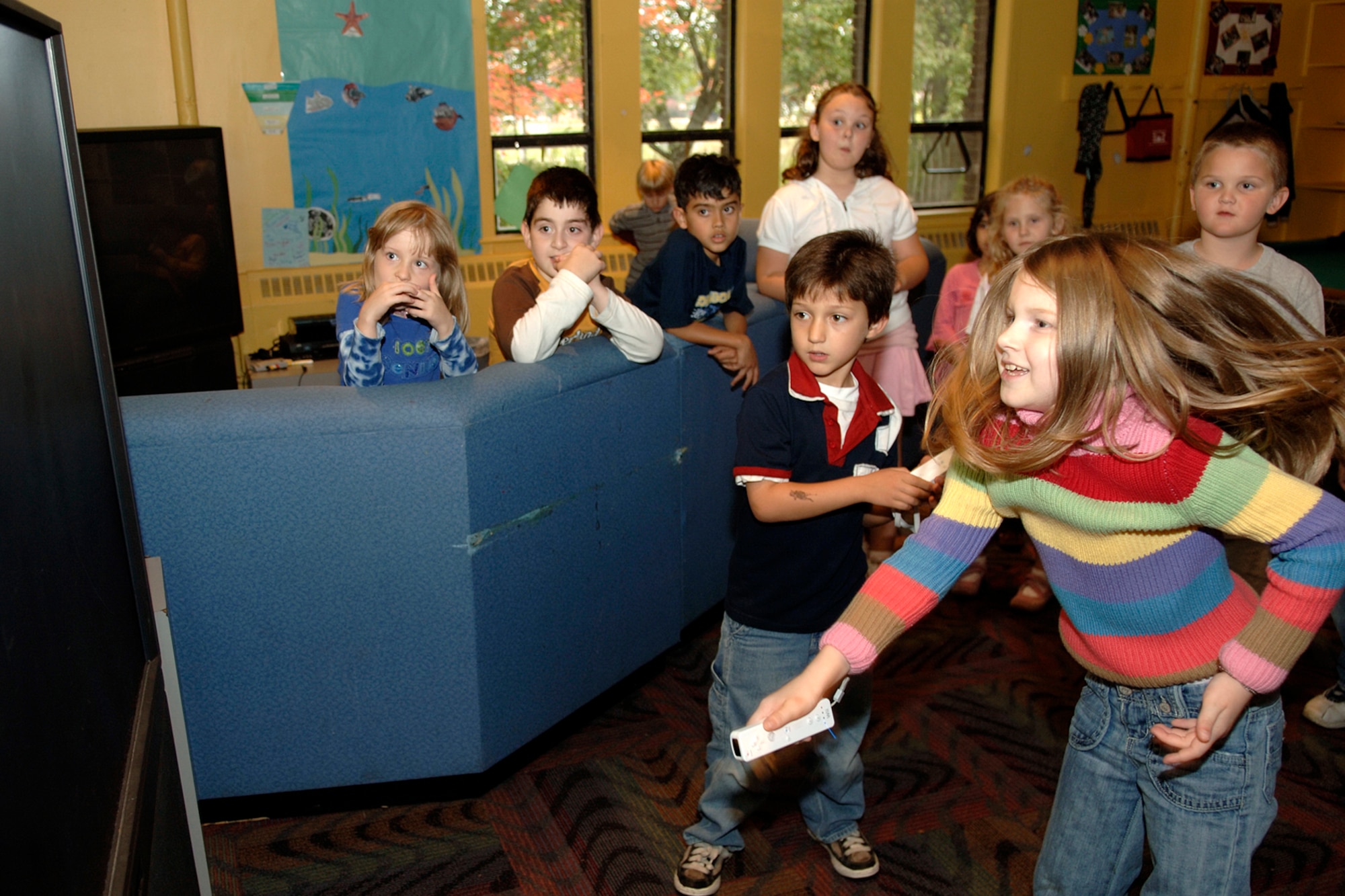 HANSCOM AFB, Mass. – Christian Ruiz (left) and Becky Peel go head to head during a Nintendo Wii ™ video game challenge during the Lights on Afterschool event that promoted the importance of Afterschool programs for youth. Activities included sports, a video game tournament, arts and crafts, a cooking activity and more. (U.S. Air Force photo by Jan Abate)