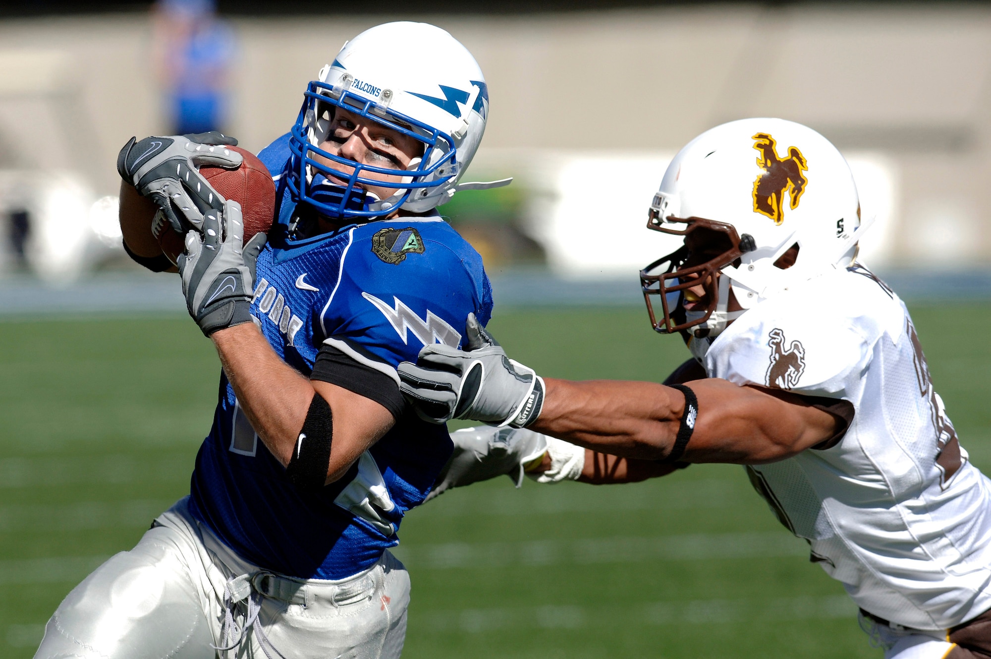 U.S. Air Force Academy Falcons z-back Chad Hall eludes a Wyoming defender during Air Force's 20-12 win Oct. 20 at Falcon Stadium in Colorado. Hall rushed for a game-high 167 yards to up his career total to 1,878, the eighth highest in Academy history. (U.S. Air Force photo/Mike Kaplan) 
