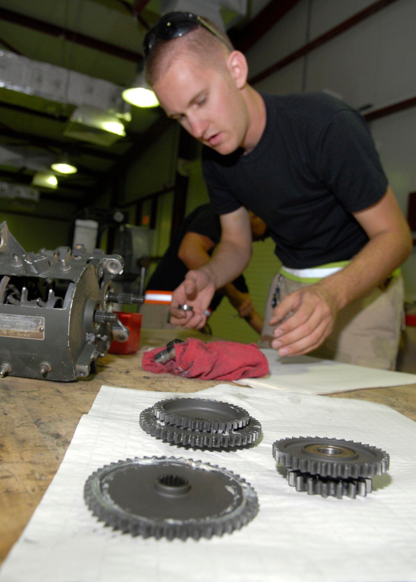 Staff Sgt. Alec Cawlfield performs preventive maintenance Oct. 22 on a universal ammunition loading system in his maintenance shop at Balad Air Base, Iraq.  Sergeant Cawlfield is deployed from the Indiana Air National Guard's 122nd Fighter Wing in Ft. Wayne. He is assigned to the 332nd Expeditionary Maintenance Squadron. (U.S. Air Force photo/Staff Sgt. Joshua Garcia)