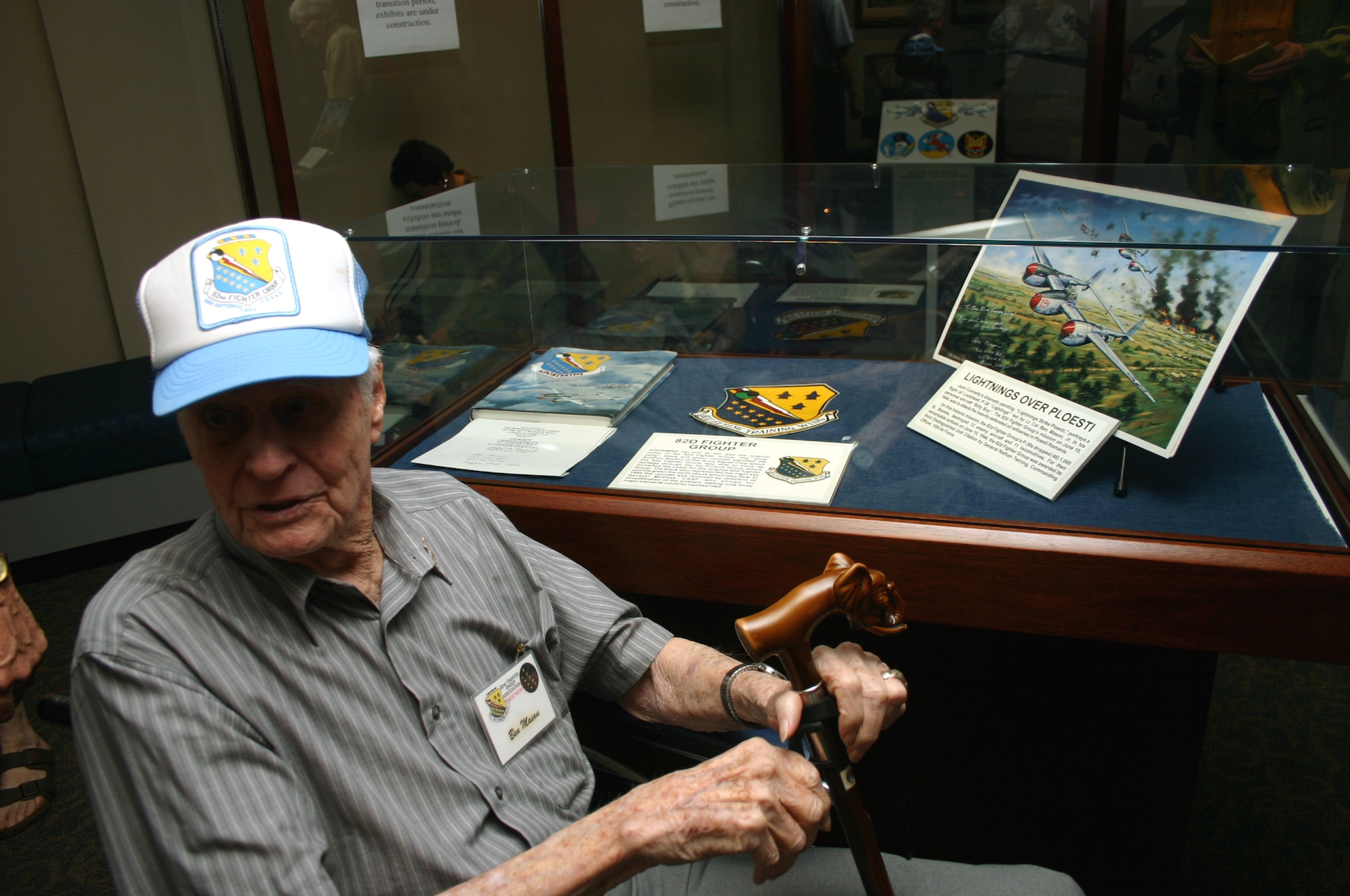 Col. Ben Mason, retired, sits before the Heritage Center display representing his 1944 air stike over Ploesti.  Colonel Mason and other members of the 82nd Fighter Group were touring Sheppard while attending a reunion Oct. 18. (U.S. Air Force photo/Staff Sgt. Tonnette Thompson)