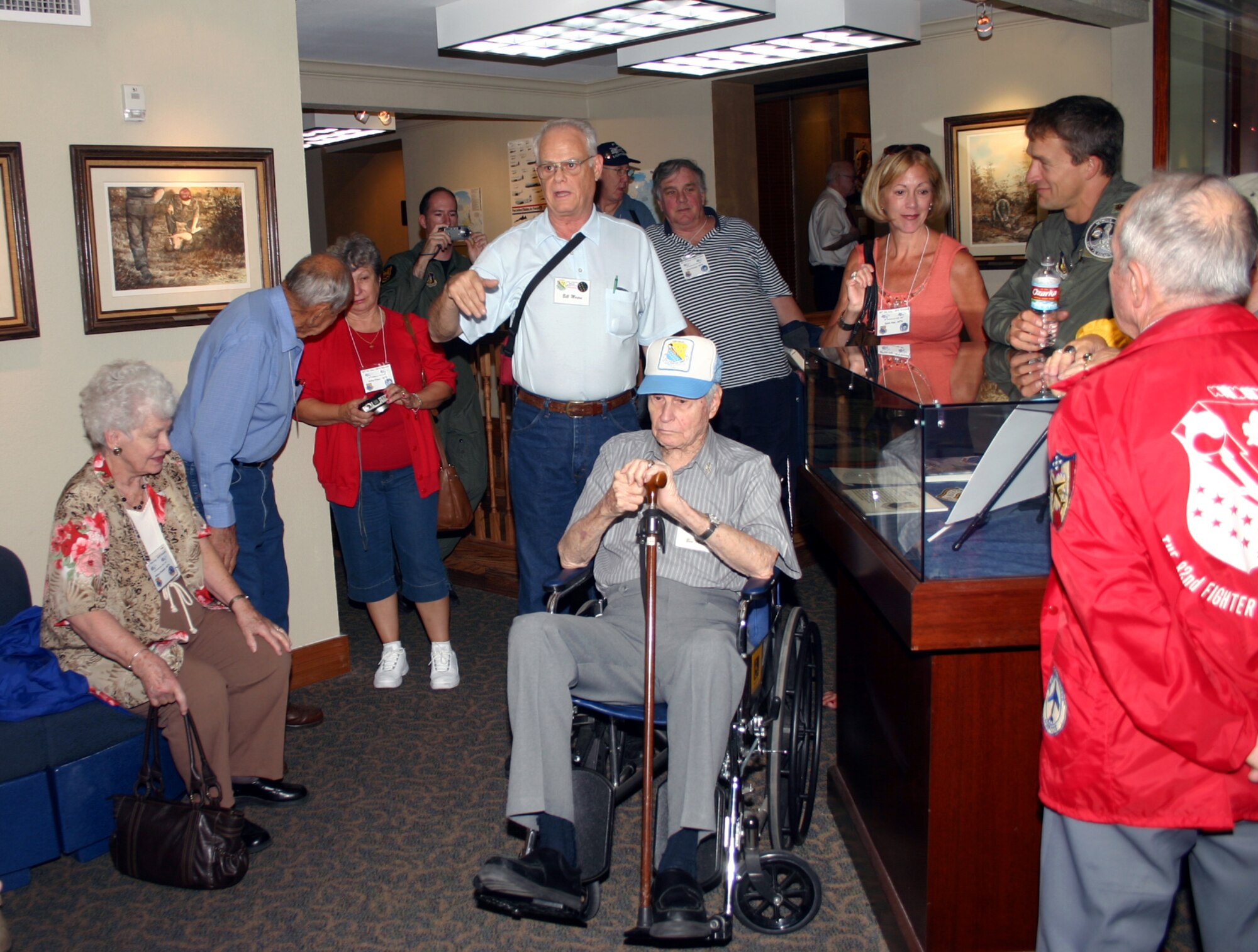 Members of the 82nd Fighter Group reunion listen as Bill Mason (center) tells the story of his father, Col. Ben Mason (seated) and his 1944 air strike over Ploesti.  The 82nd FG visited Sheppard Oct. 18.  (U.S. Air Force photo/Staff Sgt. Tonnette Thompson)