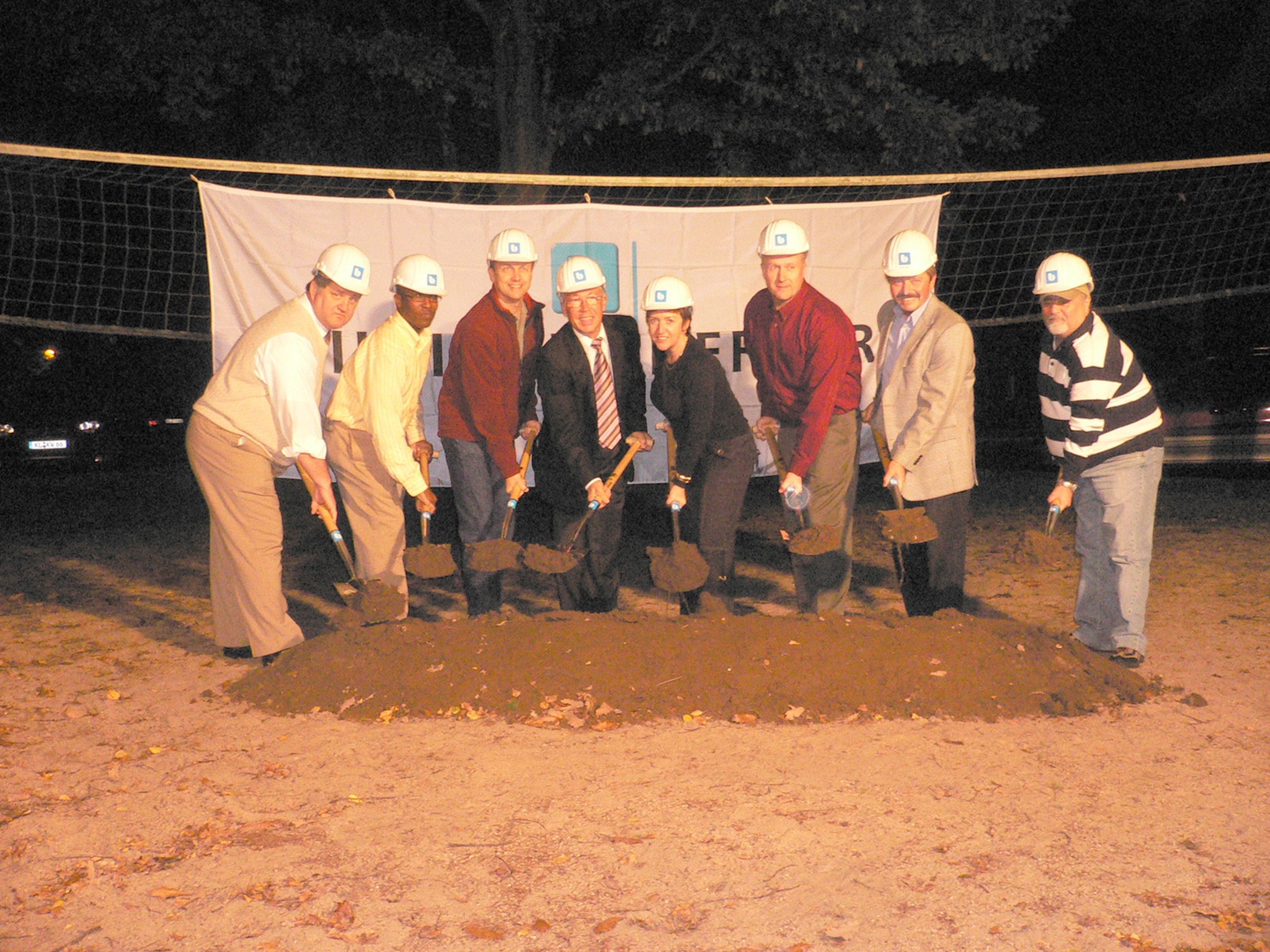 Left to right, Gary Newton, 700th Contracting Squadron; Maj. Damian Wilborne, 700th CONS; Col. Earl Matthews, 435th Air Base Wing commander; Karl-Heinz Herrmann, Bilfinger Berger; Marianne Seufert, 700th CONS; Lt. Col. Julian Thrash, 700th CONS commander; Fritz Compter, Bilfinger Berger and Resat Aydoslu, 700th CONS, break ground at midnight on Rhine Ordnance Barracks.