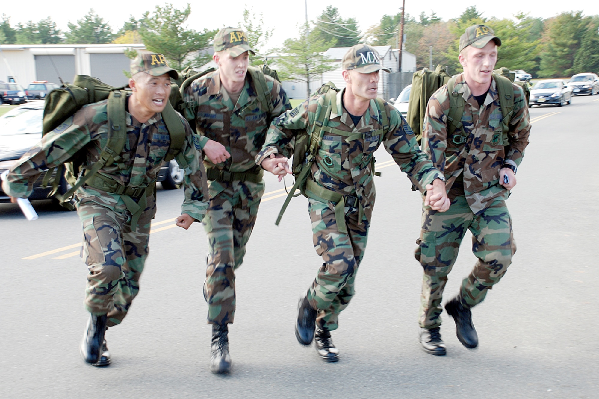 The winners of the Inaugural McGuire AFB Ruck March round the last corner to the six-mile ruck here Oct. 20. The ruck was to help honor the Gold Star Mothers, who have lost a son or daughter in the service of our country.  (U.S. Air Force photo / Airman 1st Class Rebekah Phy)