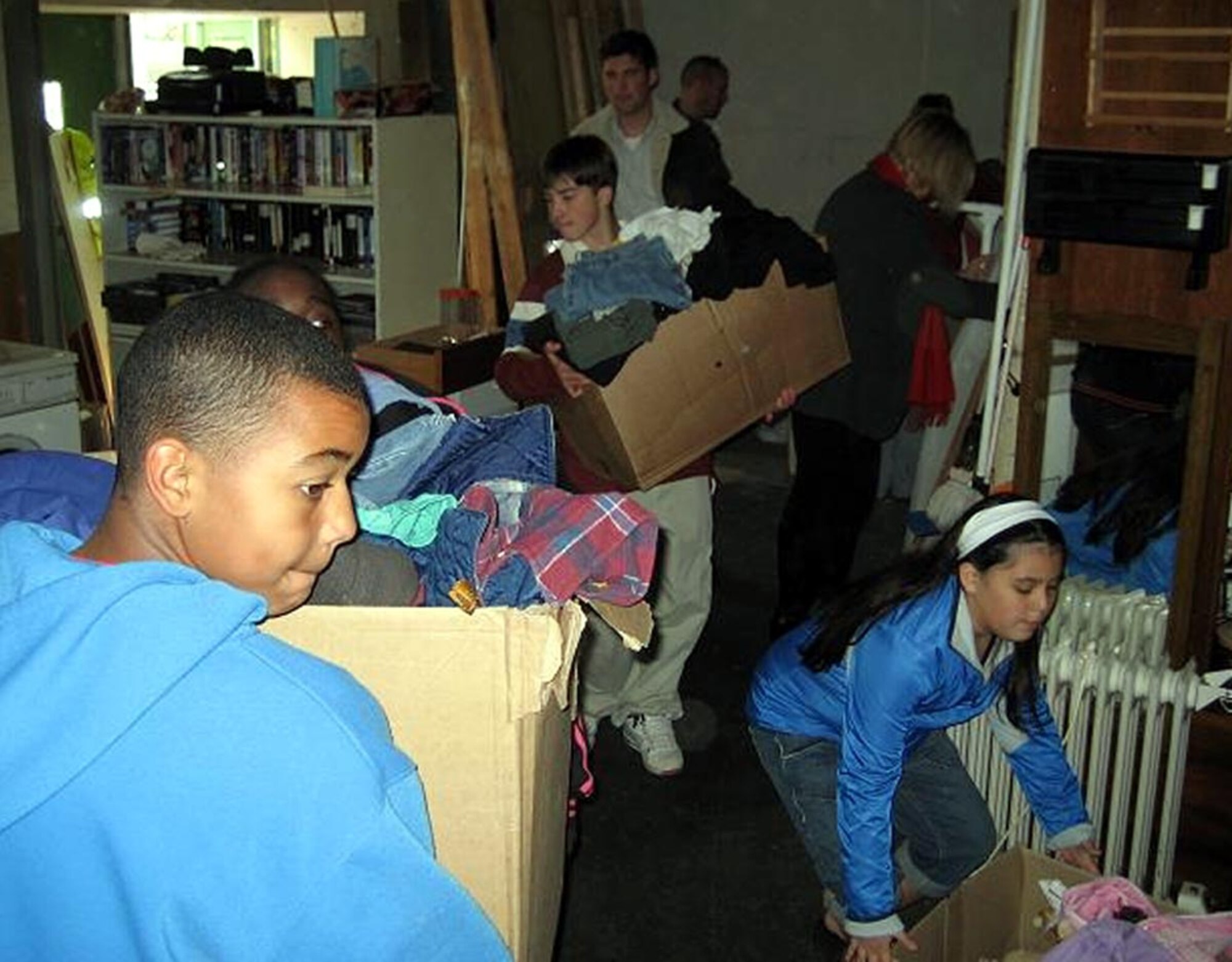 SPANGDAHLEM AIR BASE, Germany – Members of the Spangdahlem Air Base Keystone Club unload donations of clothing and miscellaneous items collected though the Make a Difference program at the Trier Homeless Center Haus Lukas Oct. 20. The Make a Difference program is a Boys and Girls Club of America Keystone chartered program that helps the communities on and off base. (Courtesy photo) 