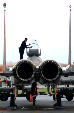 A maintainer from the 44th Aircraft Maintenance Unit cleans the canopy of an F-15C Eagle here before take-off Oct. 23.  The maintainers are supporting training missions based on real-world scenarios as part of Local Operational Readiness Exercise Beverly High 08-1. (U.S. Air Force photo/Tech. Sgt. Rey Ramon)
