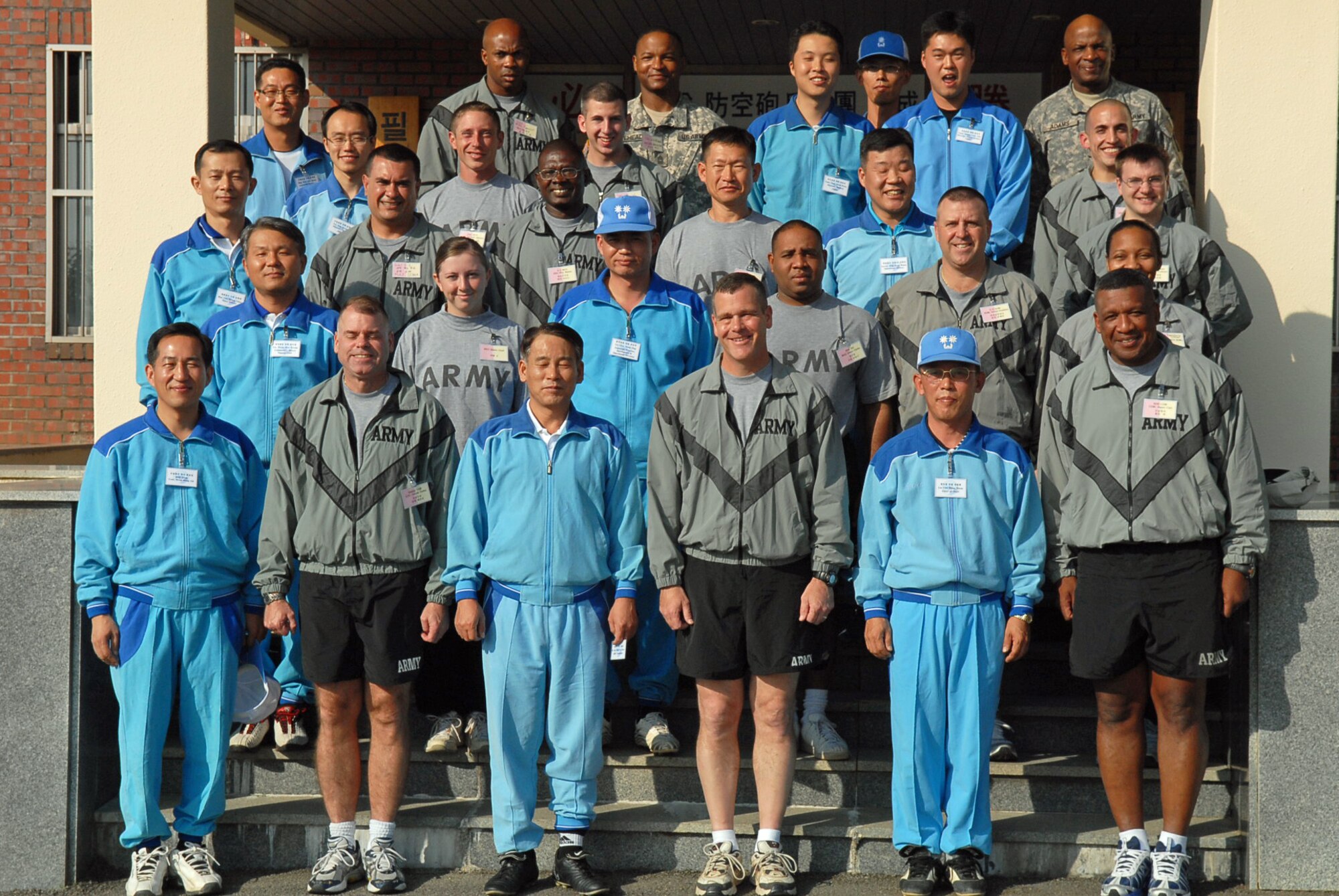 OSAN AIR BASE, Republic of Korea --  The 35th Air Defense Artillery Brigade and the Republic of Korea’s 2nd ADA BDE pose for a photo before the start of the Goodwill Soccer Match on Oct. 18. (U.S. Air Force photo by Pfc. Gretchen N. Goodrich)