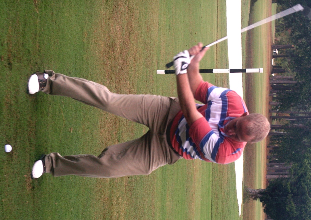 MARINE CORPS BASE CAMP LEJEUNE, N.C. (Oct. 24, 2007) -Cpl. Eric S. Minton takes a swing during the 2nd Marine Logistics Group Golf Tournament, here, Oct. 24. The 10th annual Golf Tournament was a moment for a total of 29 teams to enjoy camaraderie outside of the office. Minton is a landing support specialist with Landing Support Company, Combat Logistics Regiment 27, 2nd MLG.