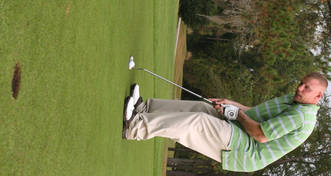 MARINE CORPS BASE CAMP LEJEUNE, N.C. (Oct. 24, 2007) ?Sgt. Justin A. Crauder putts on the green during the 2nd Marine Logistics Group Golf Tournament, here, Oct. 24. The 10th annual Golf Tournament was a moment for a total of 29 teams to enjoy camaraderie outside of the office. Crauder is a landing support specialist with Landing Support Company, Combat Logistics Regiment 27, 2nd MLG.