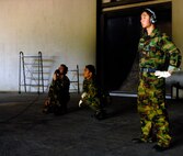 JUNGWON AIR BASE, South Korea -- Republic of Korea Air Force Staff Sgt. Hyunjun Choi stands by as U.S. Air Force Staff Sgt. Craig Simpson and  ROKAF Tech. Sgt. Yusan Song, run through a systems check prior to launching an F-16 Fighting Falcon from the 8th Fighter Wing, Kunsan Air Base, South Korea during a Buddy Wing program exercise here Oct. 24.  Sergeants Choi and Song are assigned to the 161st Maintenance Squadron and Sergeant Simpson is a crew chief with the 80th Aircraft Maintenance Squadron. The Buddy Wing program is a way for U.S. Air Force and Republic of Korea Air Force Airmen to develop teamwork, exchange ideas and improve war time tactics.  (U.S. Air Force photo/Senior Airman Steven R. Doty)