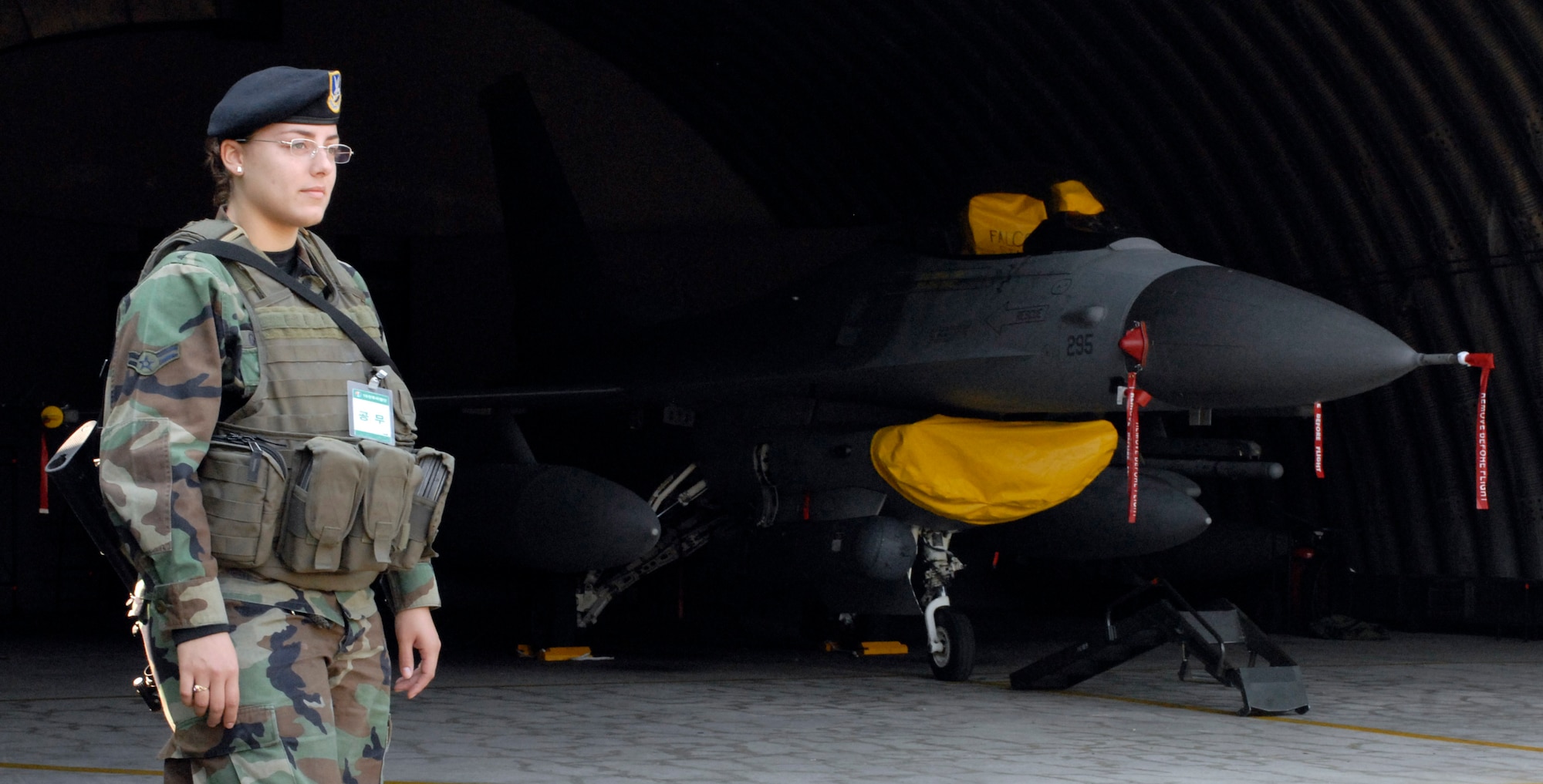 JUNGWON AIR BASE, South Korea - Airman 1st Class Ivelisse Gonzalez provides security for an F-16 Fighting Falcon from the 8th Fighter Wing, Kunsan Air Base, South Korea during the Buddy Wing program here Oct. 24. Airman Gonzalez is assigned to the 8th Security Forces Squadron. The Buddy Wing program is a way for U.S. Air Force and Republic of Korea Air Force Airmen to develop teamwork, exchange ideas and improve war time tactics.  (U.S. Air Force photo/Senior Airman Steven R. Doty)