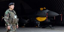 JUNGWON AIR BASE, South Korea - Airman 1st Class Ivelisse Gonzalez provides security for an F-16 Fighting Falcon from the 8th Fighter Wing, Kunsan Air Base, South Korea during the Buddy Wing program here Oct. 24. Airman Gonzalez is assigned to the 8th Security Forces Squadron. The Buddy Wing program is a way for U.S. Air Force and Republic of Korea Air Force Airmen to develop teamwork, exchange ideas and improve war time tactics.  (U.S. Air Force photo/Senior Airman Steven R. Doty)