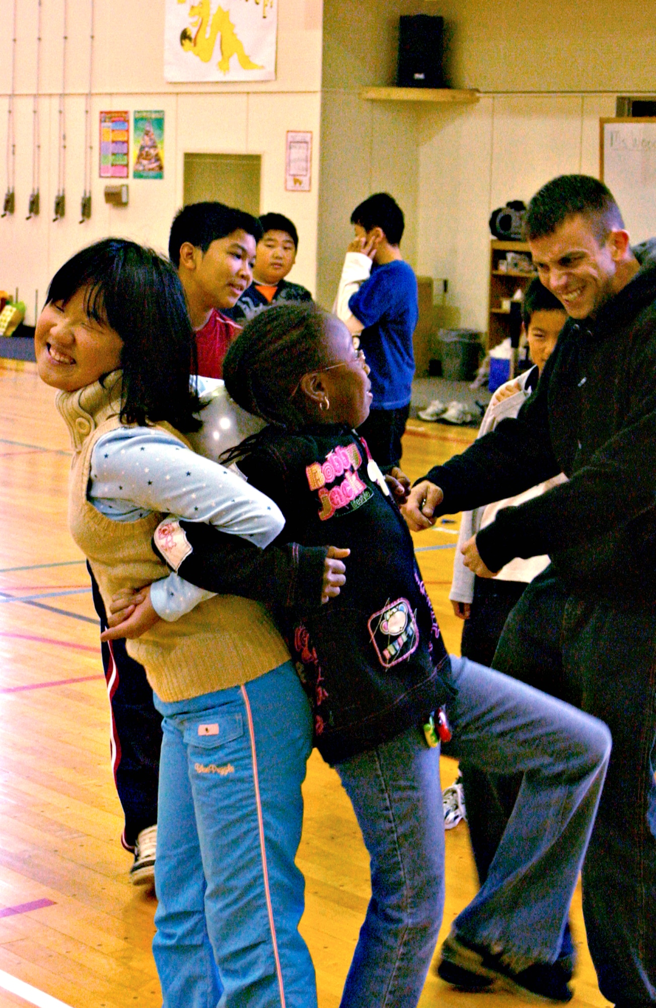 MISAWA AIR BASE, Japan -- Mao Kashiwazaki and Faith Moss play a game where the object is to pop a balloon between their backs at Sollars Elementary School, Oct. 20, 2007. Mao is a student at Kinoshita Elementary School in Oirase Town participating in a cultural exchange program here on Misawa where Faith attends school.
(U.S. Air Force photo by Airman 1st Class Eric Harris)(RELEASED)