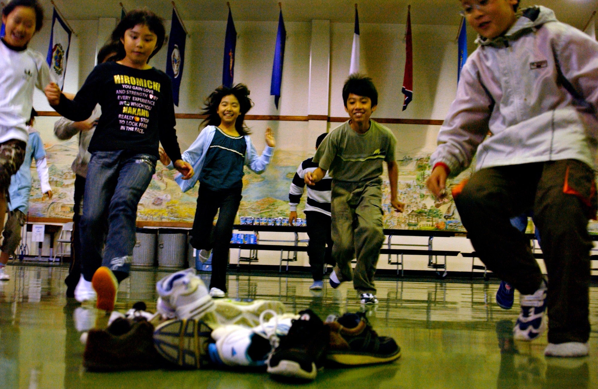 MISAWA AIR BASE, Japan -- Japanese elementary school students run to pickup a shoe as part of a game to meet and interact with American students at Sollars Elementary School, Oct. 20, 2007.  The Japanese children came from three elementary schools in Oirase Town as part of a cultural exchange program that has been running for 15 years.
(U.S. Air Force photo by Airman 1st Class Eric Harris)(RELEASED)