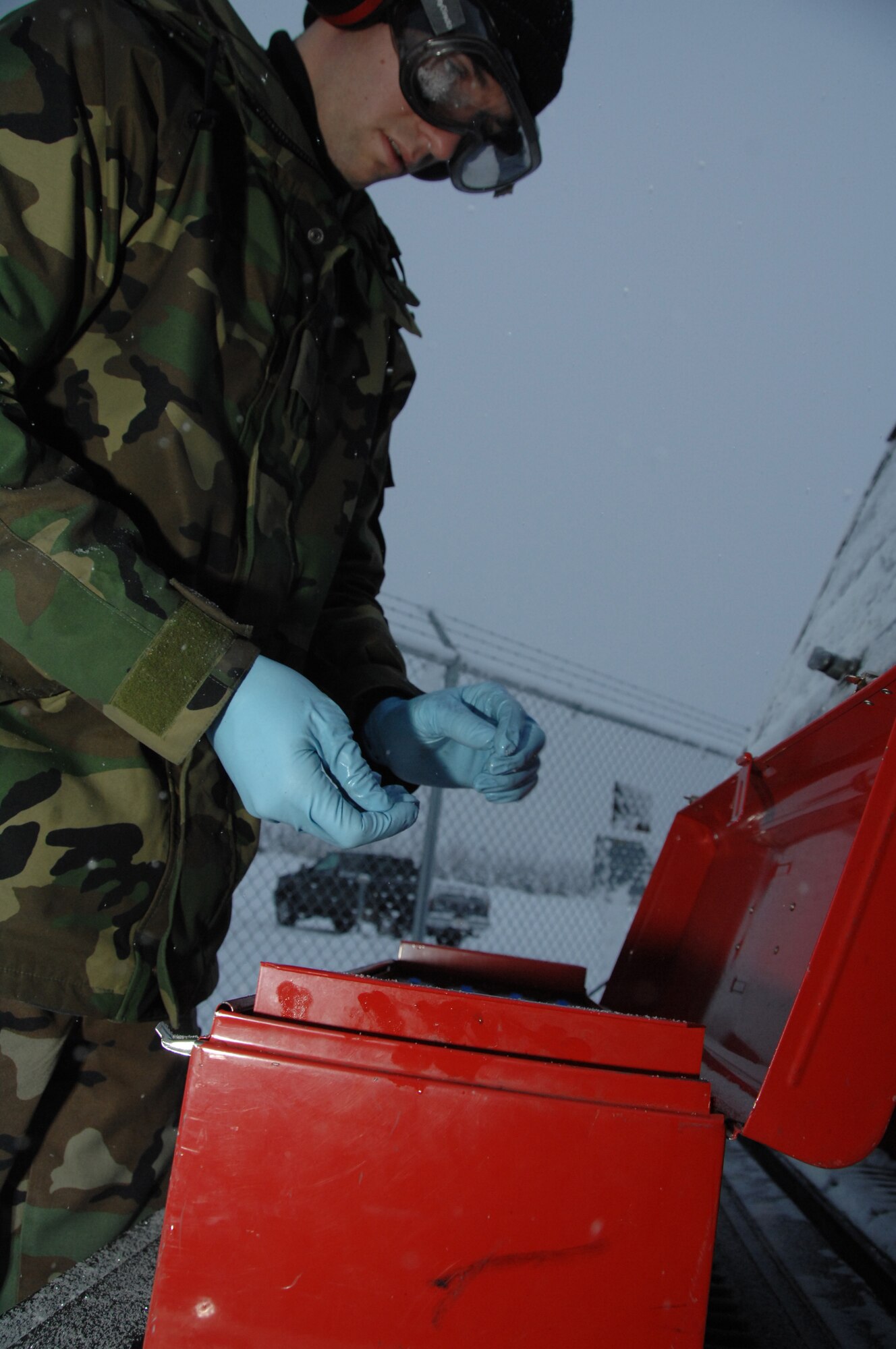 EIELSON AIR FORCE BASE, Alaska --  Airman 1st Class Sean McDonagh, 354th Logistic Readiness Squadron fuels laboratory technician, organizes his fuel sampling instruments Oct. 24, 2007, at the POL yard. Making sure the fuel used by the aircraft here at Eielson is always good to go, Airman McDonagh helps assure the process by constantly sampling the fuel lines and also the trucks that distribute it to the aircraft.  (U.S. Air Force photo by Airman 1st Class Christopher Griffin)