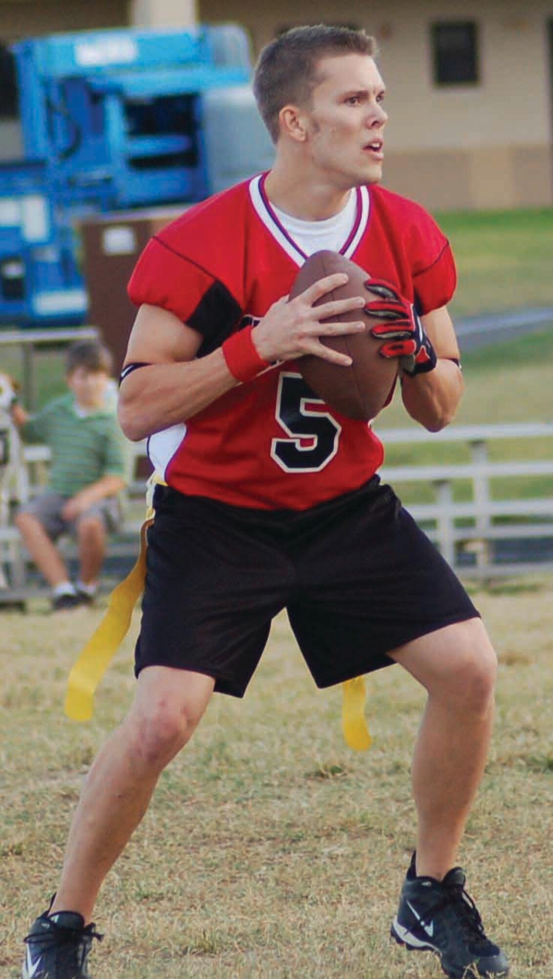 72nd Operational Support Squadron Thunderhawks quarterback Justin Hackbarth drops back to pass during an intramural flag football game against the Guard Dogs on Oct. 18 at the Tinker Sports Complex. The Thunderhawks won the game 14-6. (Air Force photo by John E. Banks)
