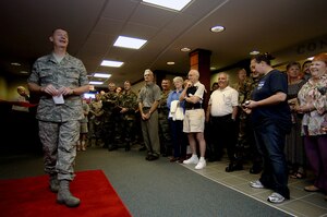 Members of Team Charleston attend the ribbon-cutting ceremony of the newly rennovated base theater Thursday on Charleston AFB. (U.S. Air Force photo/Airman 1st Class Nicholas Pilch) 