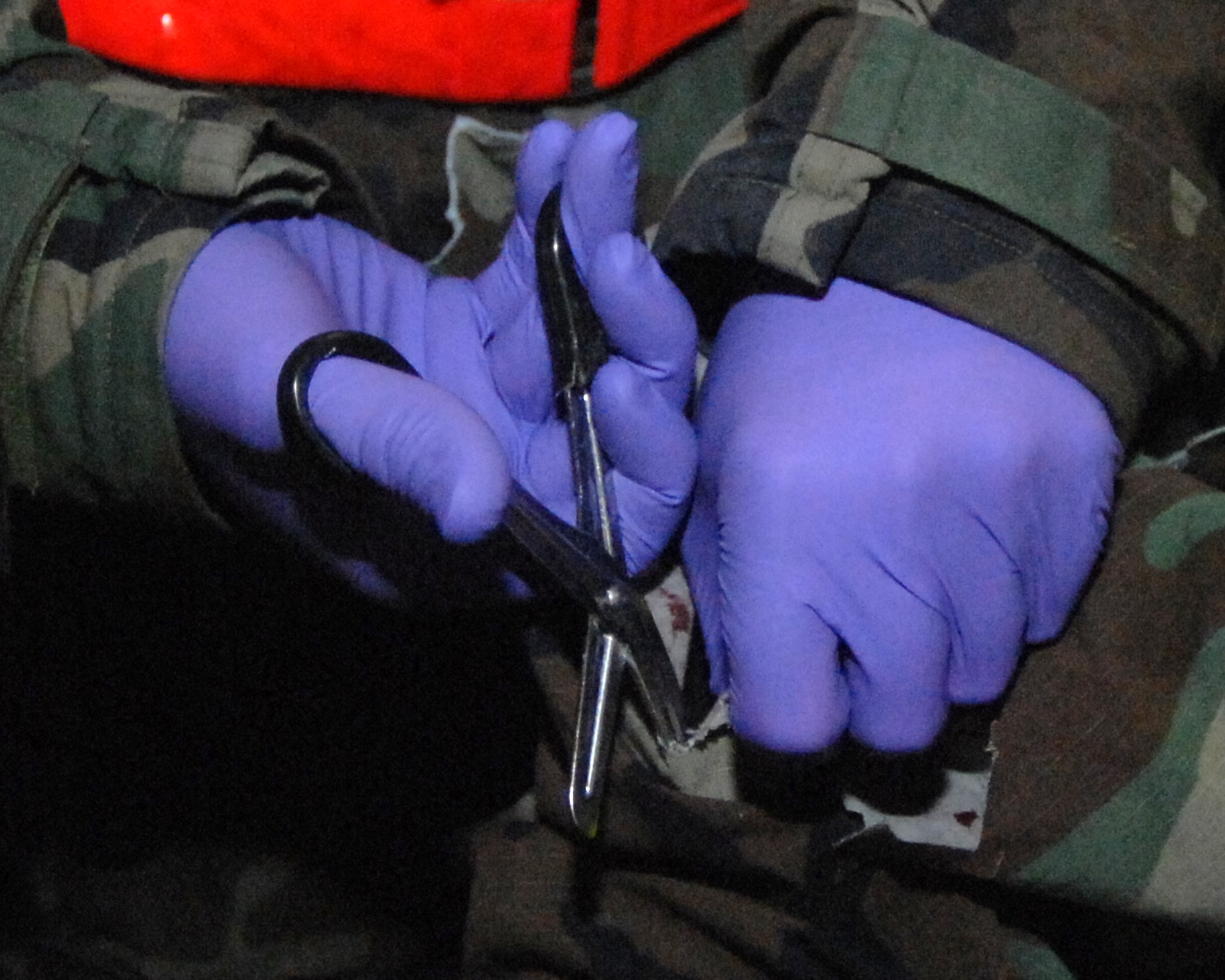 MOUNTAIN HOME AIR FORCE BASE, Idaho -- Senior Airman Brandon Wilson, 366th Equipment Maintenance Squadron metals technician, simulates an injured arm while Tech. Sgt. Randall Cross, 366th Medical Operations Squadron medical technician, treats his injuries during the Phase II portion of the deployment exercise here Oct 24. Gunfighters are participating in Exercise Sharpshooter 08-01 in preparation for the operational readiness inspection in March 2008. (U.S. Air Force photo/ Airman 1st Class Stephany Miller)