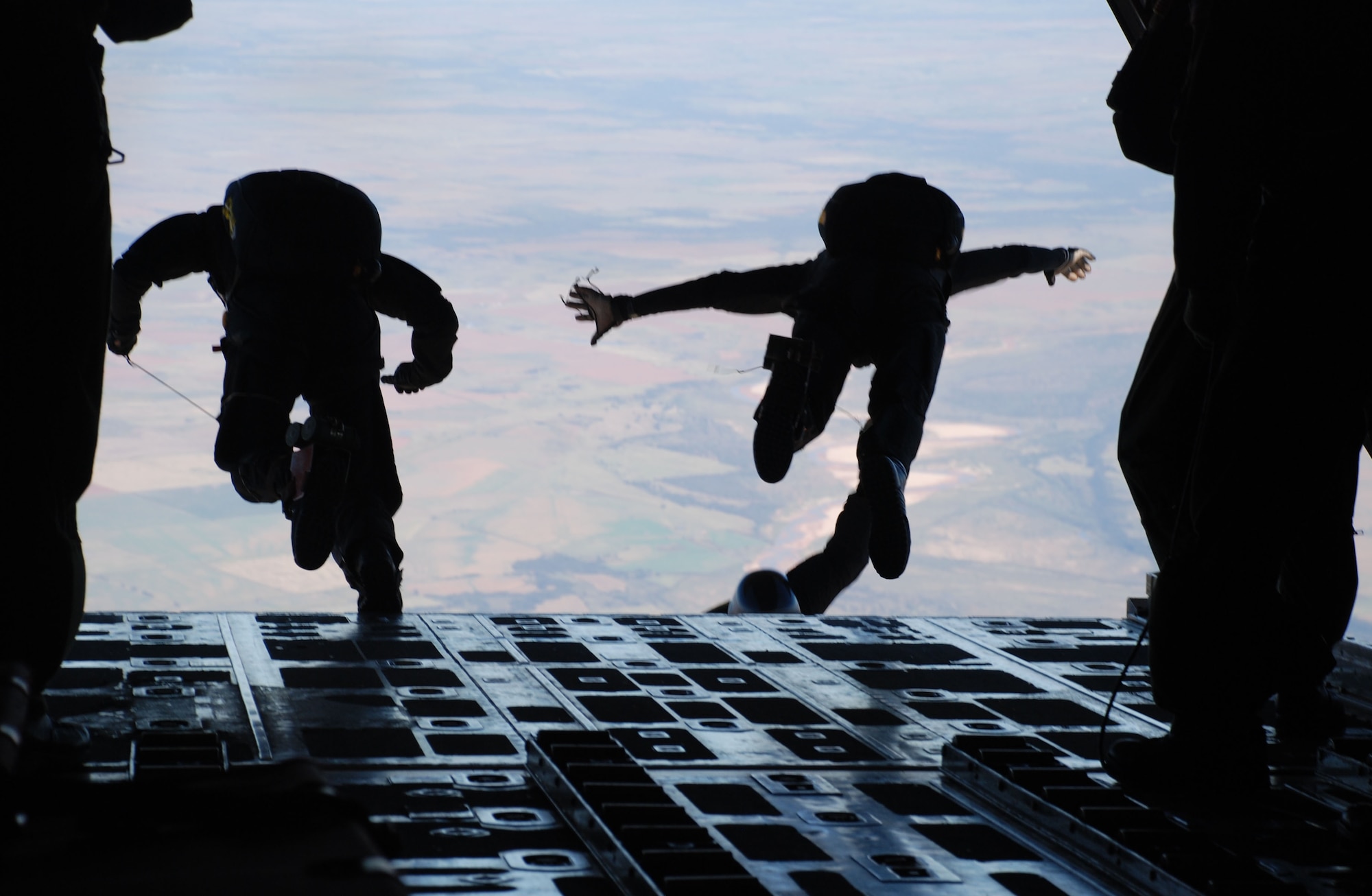 Members of the Special Operations Command Parachute Team leap from the rear of a C-130 Hercules during a practice jump Oct. 19. The team made their demonstration jump Oct. 20 at the 2007 Sheppard Open House and Air Show. (U.S. Air Force photo/Airman 1st Class Jacob Corbin)