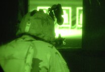 MINOT AIR FORCE BASE, N.D. -- An Airman from the 91st Security Forces Group, takes aim at a target inside the base firing range here Oct. 15. Security forces members often practice firing during nighttime to be prepared for any situation. (U.S. Air Force photo by Senior Airman Christopher Boitz)