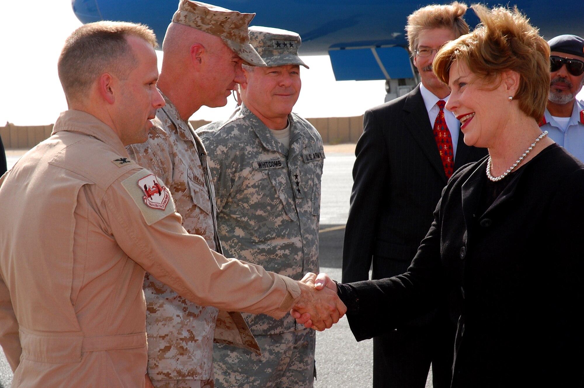 First Lady Laura Bush meets Col. Brian O'Connor Oct. 19 at an undisclosed location in Southwest Asia. The first lady's visit highlights the accomplishments of the Middle East Partnership Initiative programs of the State Department, and also to visit a number of programs in countries that have launched the U.S. and Middle East partnership for breast cancer awareness and research. Colonel O'Connor is the 386th Air Expeditionary Wing vice commander. (U.S. Air Force photo/Staff Sgt. Tia Schroeder) 