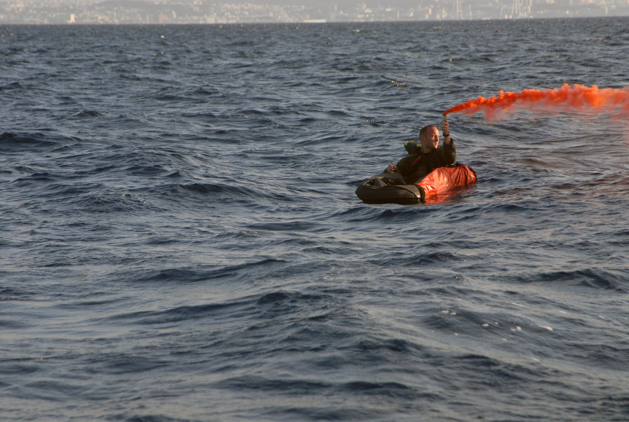 Capt. Derek Flynn, 67th Fighter Squadron, waits for rescue in the waters off the coast of Okinawa. Captain Flynn was placed in the water as part of a Survival Evasion Resistance Escape exercise at Kadena Air Base, Okinawa, Oct. 24, 2007, during Local Operational Readiness Exercise Beverly High 08-1. (U.S. Air Force photo/Staff Sgt. Christopher Marasky) 