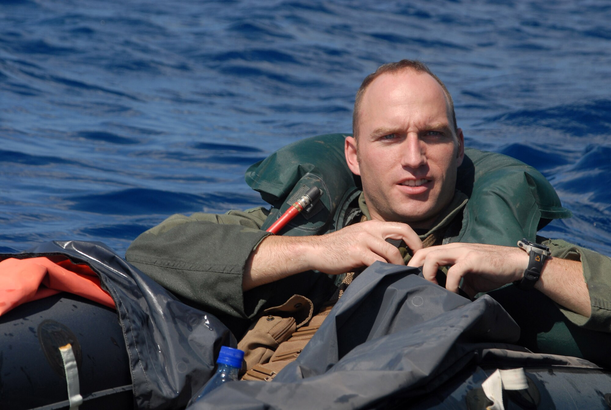 Capt. Derek Flynn, 67th Fighter Squadron, waits for rescue in the waters off the coast of Okinawa. Captain Flynn was placed in the water as part of a Survival Evasion Resistance Escape exercise at Kadena Air Base, Okinawa, Oct. 24, 2007, during Local Operational Readiness Exercise Beverly High 08-1. (U.S. Air Force photo/Staff Sgt. Christopher Marasky) 
