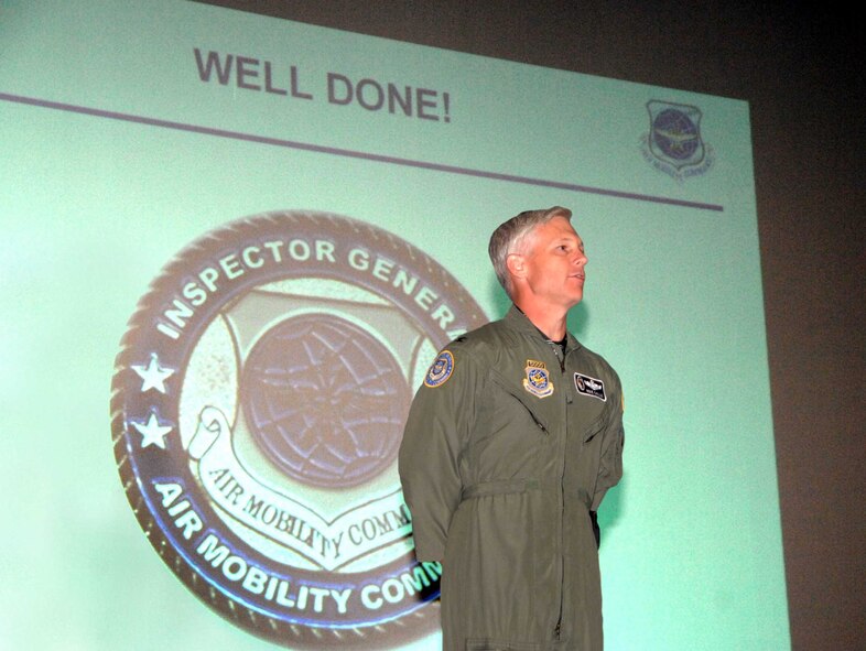 Col. Mike Callis, Air Mobility Command deputy inspector general, tells members of the 615th Contingency Response Wing "Well Done" during the 615th CRW's Operational Readiness Inspection out-brief. The ORI was designed to test the 615th CRW's ability to open up and handover an operational airbase. The wing earned an overall "Excellent" rating. (U.S. Air Force photo/Nan Wylie)