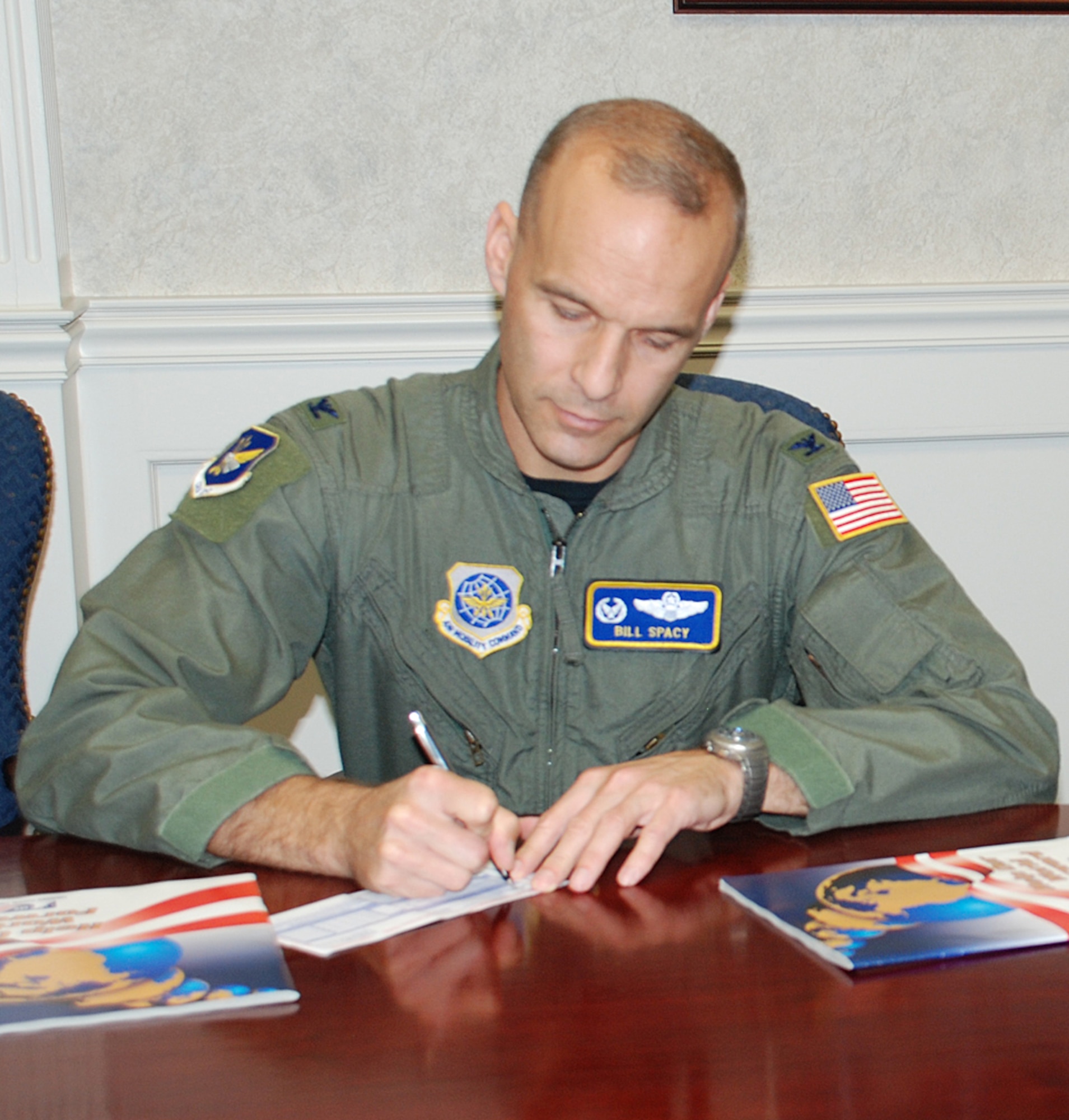 Col. Bill Spacy, 305th Air Mobility Wing vice commander, makes a contribution to the Combined Federal Campaign Oct. 24. The McGuire CFC will run through Nov. 30; to make a contribution, contact your unit CFC representative. (U.S. Air Force photo / Senior Airman Danielle Johnson)