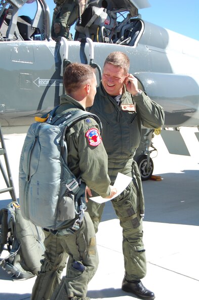 LAUGHLIN AIR FORCE BASE, Texas – Vice wing commander Col. Laro Clark (right) receives a certificate documenting his 2,000th T-38 flying hour from Lt. Col. Dean Lee who commands the 87th Flying Training Squadron's Red Bulls.  The 87th is responsible for conducting the final phase of specialized undergraduate pilot training for students who will continue on in the fighter/bomber track.  In 2007, Laughlin graduated 346 of the world's best trained pilots.  Colonel Clark adds this personal flying milestone to many others including service on the East Coast F-15 Aerial Demonstration Team, rating as a Euro-NATO Joint Jet Pilot and 220 combat hours in the F-15. He will deploy in January 2008 in support of the Global War on Terror. (U.S. Air Force Photo/Airman Sara Csurilla)