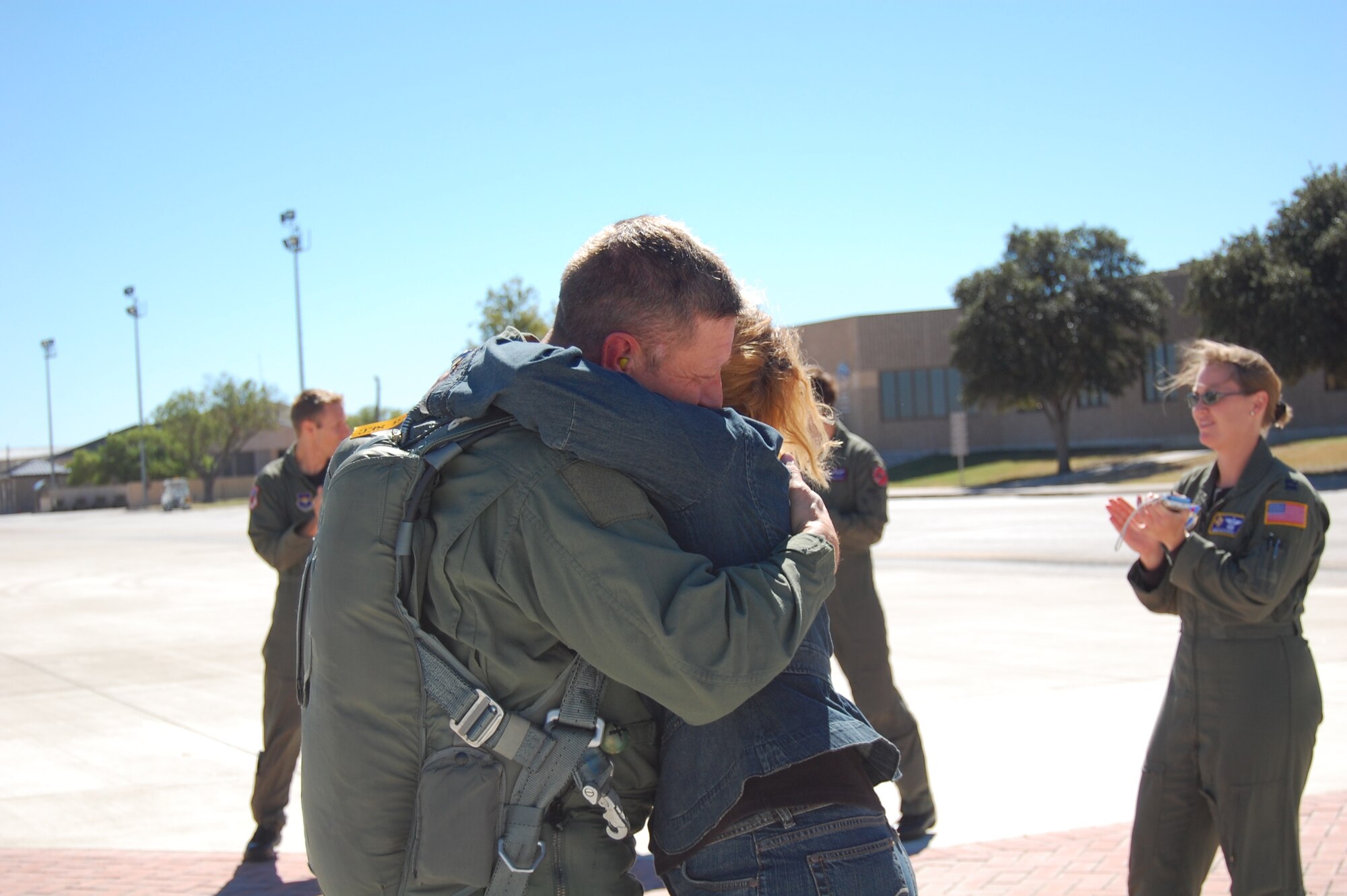 LAUGHLIN AIR FORCE BASE, Texas – After landing from his 2,000th T-38 flying hour, vice wing commander Col. Laro Clark hugs his wife, Susan. The colonel adds this personal flying milestone to many others including service on the East Coast F-15 Aerial Demonstration Team, rating as a Euro-NATO Joint Jet Pilot and 220 combat hours in the F-15. The colonel will deploy in January 2008 in support of the Global War on Terror. (U.S. Air Force Photo/Airman Sara Csurilla)