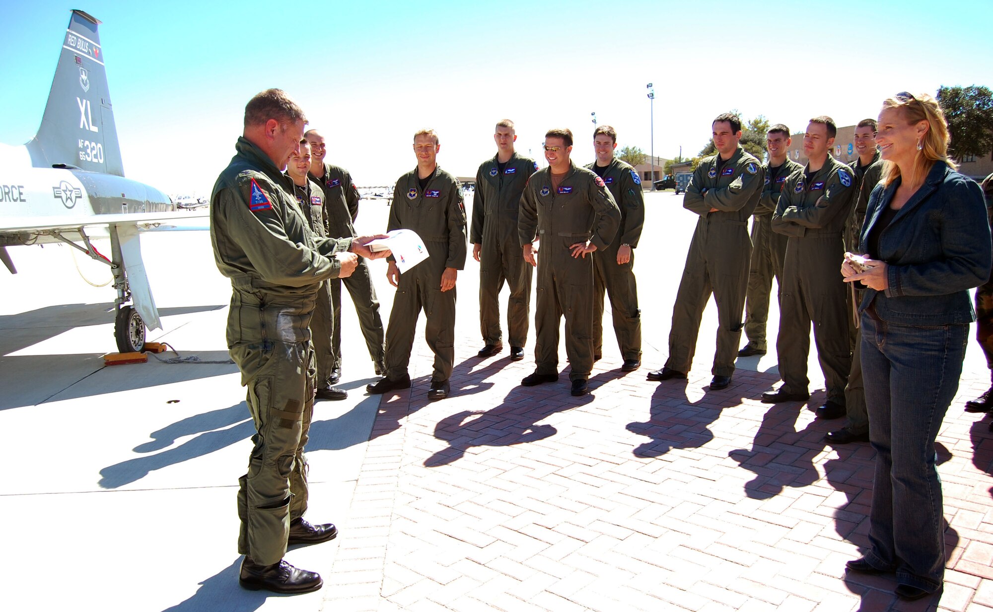 LAUGHLIN AIR FORCE BASE, Texas – Vice wing commander Col. Laro Clark (left) thanks well wishers, including wife Susan, who turned out for his return to Laughlin after reaching his 2,000th T-38 flying hour. The colonel adds the personal milestone to many others including service on the East Coast F-15 Aerial Demonstration Team, rating as a Euro-NATO Joint Jet Pilot and 220 combat hours in the F-15. The colonel will deploy in January 2008 in support of the Global War on Terror. (U.S. Air Force Photo/Airman Sara Csurilla)