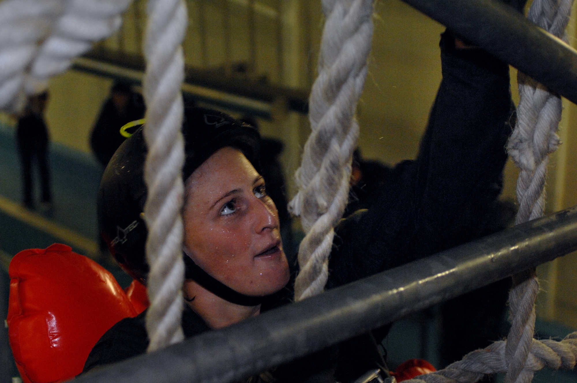 Captain Dawn Hildebrand 351st Air Refueling Squadron, climbs a rope ladder during a water survival refresh course held at Lowestoft College, Maritime and Offshore Facilities. During the water survival training students are hit with 5-foot waves, pounding rain and brutal winds – all while soaking in valuable information crucial to keeping them alive. (U.S. Air Force photo by Senior Airman Teresa M. Hawkins)