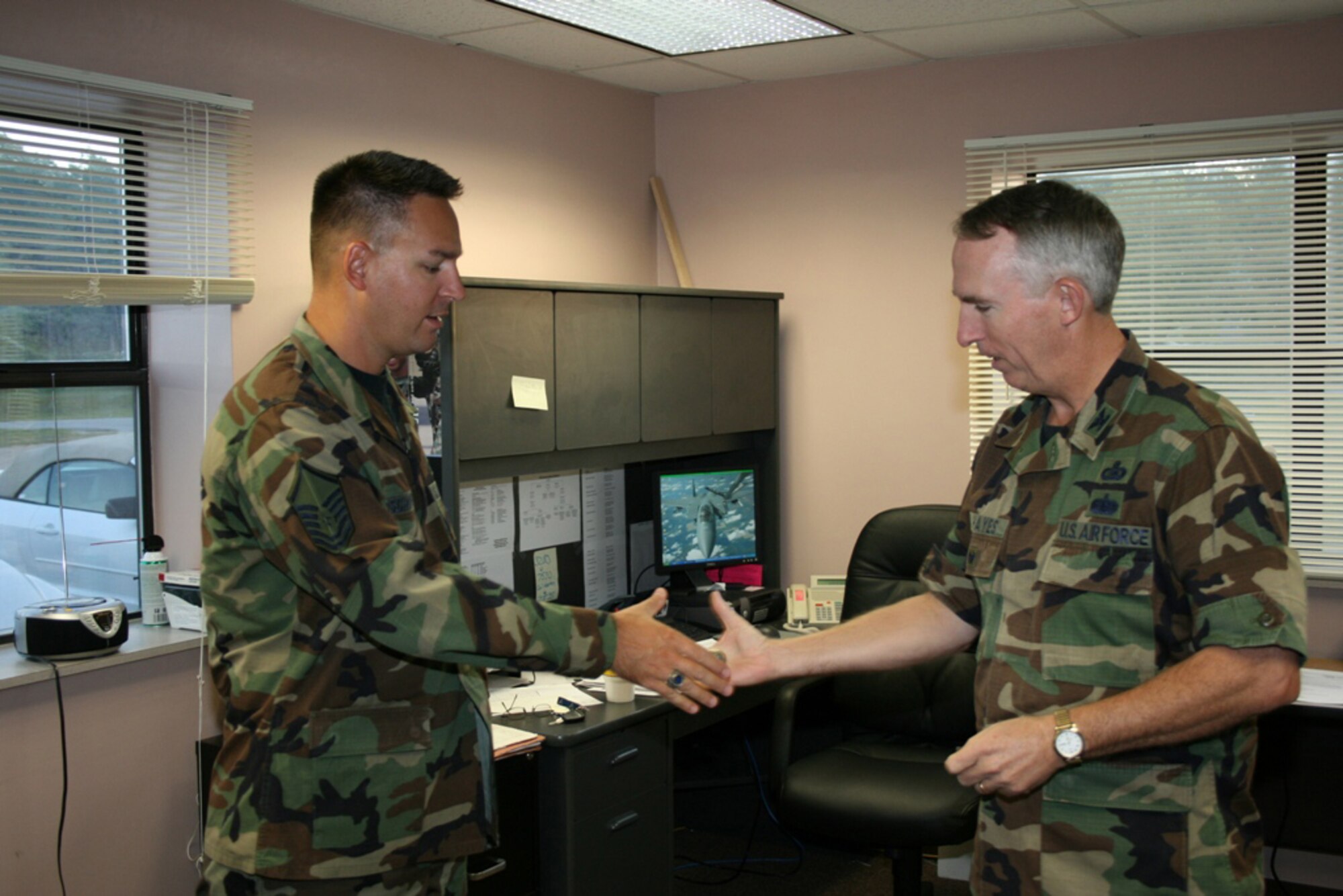 SEYMOUR JOHNSON AIR FORCE BASE, N.C.--Colonel John Hayes, AFRC/A6, director of communications, visited the men and women of the 916th Communication Squadron.  Col. Hayes has been visiting communication units to see what kind of issues he and his staff can help with.  It also gave him an opportunity to update the units on the latest comm. issues affecting the command.  For his outstanding support leading up to and during his visit, Col. Hayes presented Master Sgt. Brian Bischoff with a commander?s coin thanking him for coordinating every detail of the visit.